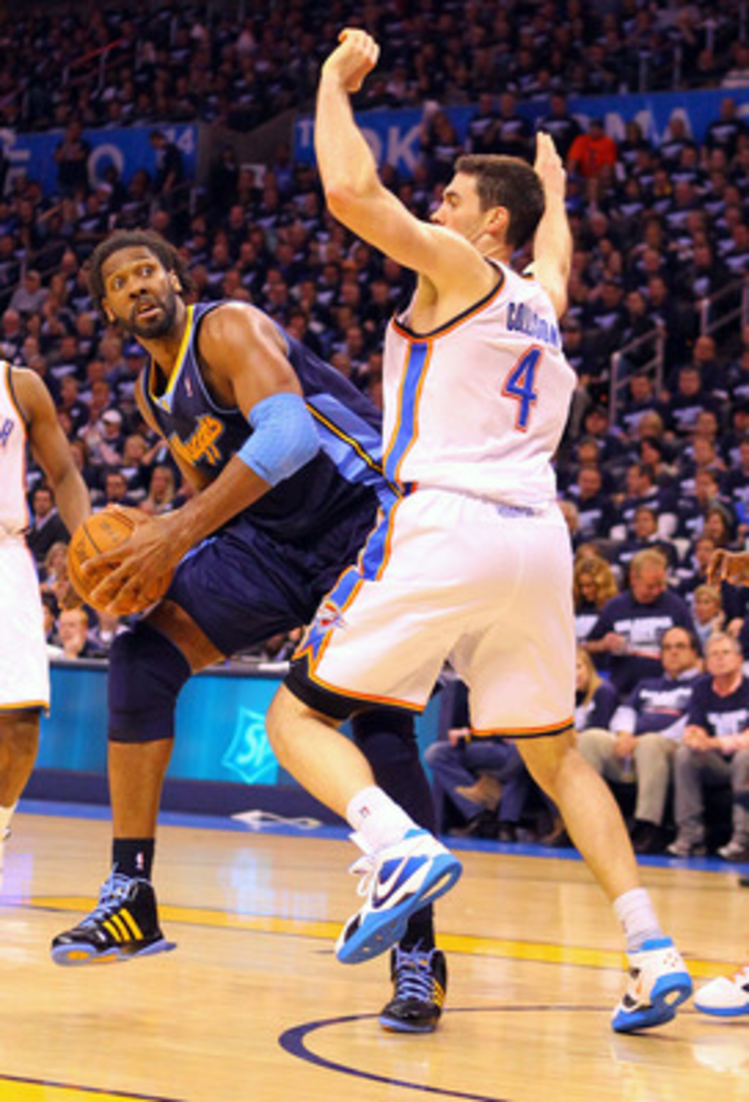 OKLAHOMA CITY, OK - APRIL 27: Nene Hilario #31 of the Denver Nuggets looks to shoot the ball against Nick Collison #4 of the Oklahoma City Thunder in Game Five of the Western Conference Quarterfinals in the 2011 NBA Playoffs on April 27, 2011 at the Ford 