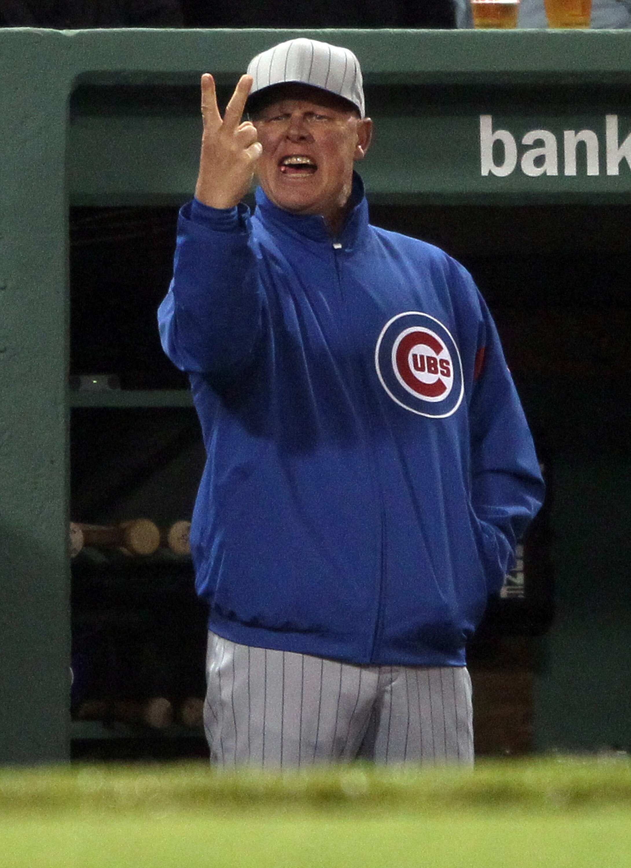 BOSTON, MA - MAY 21:  Manager Mike Quade #8 of the Chicago Cubs reacts to the home plate umpire's warning in the fifth inning against the Boston Red Sox on May 21, 2011 at Fenway Park in Boston, Massachusetts. Tonight the Chicago Cubs and the Boston Red S