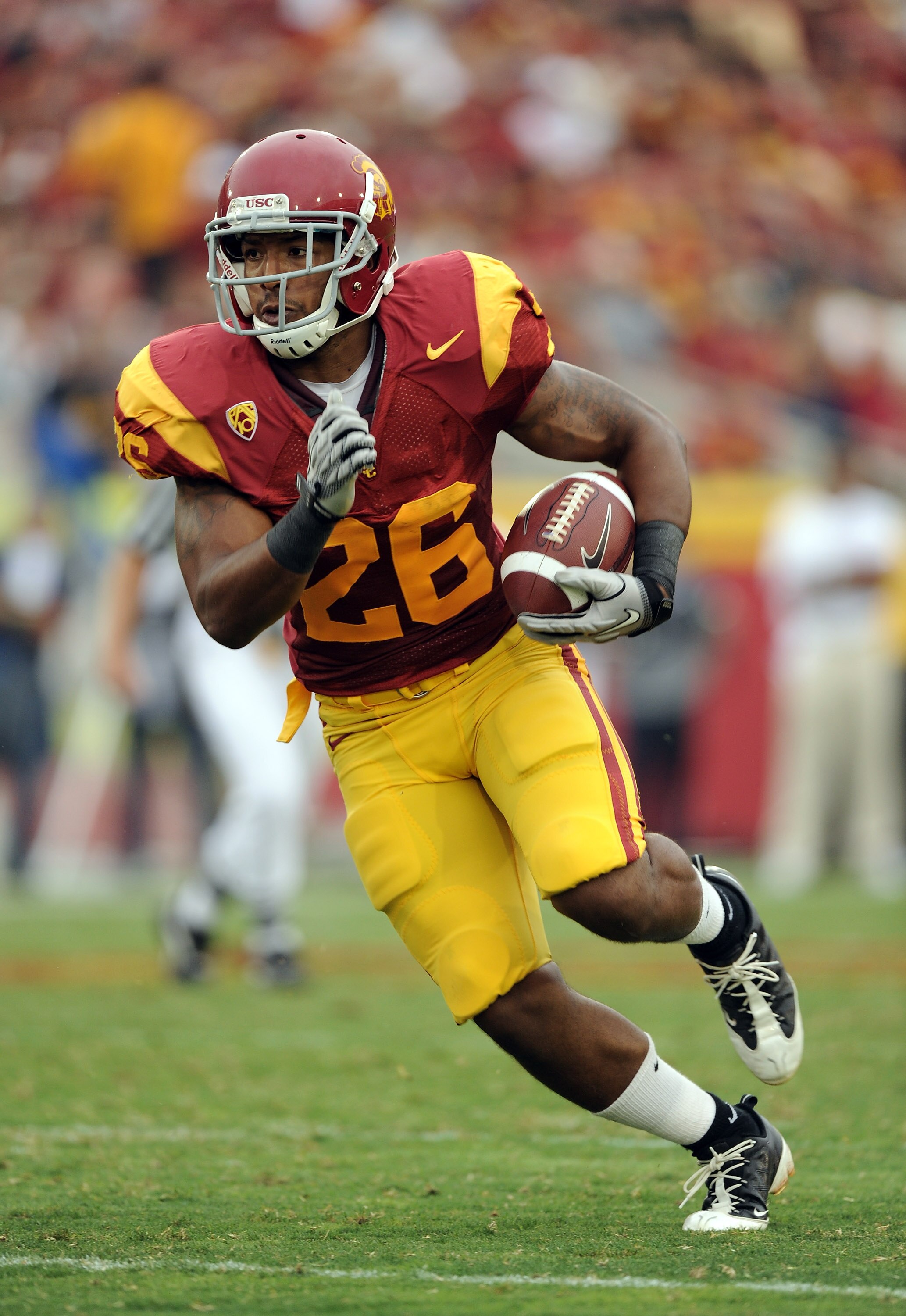 LOS ANGELES, CA - OCTOBER 16:  Marc Tyler #26 of the USC Trojans rushes the ball during the game against the California Golden Bears at Los Angeles Memorial Coliseum on October 16, 2010 in Los Angeles, California.  (Photo by Harry How/Getty Images)