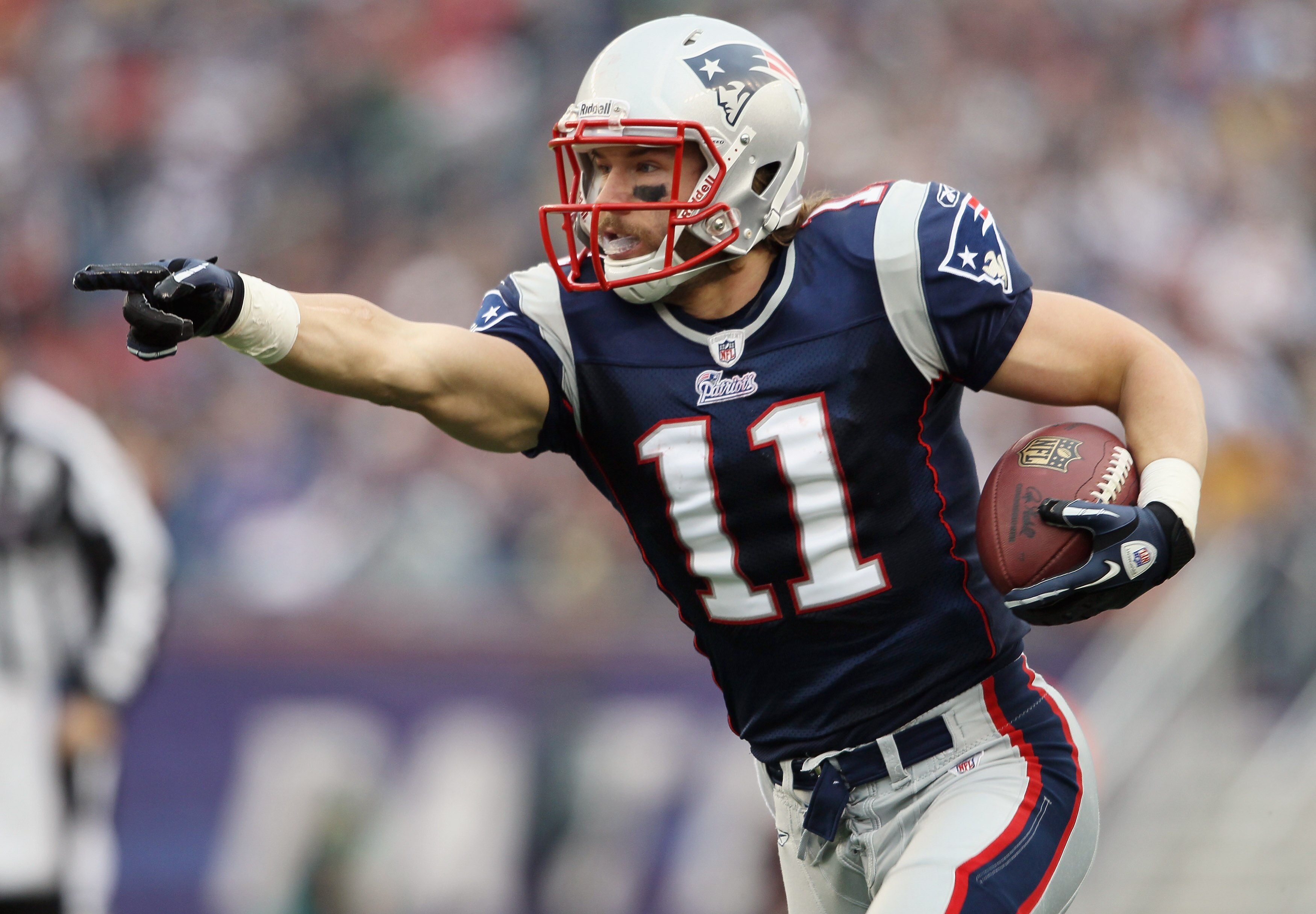 FOXBORO, MA - JANUARY 02:  Julian Edelman #11 of the New England Patriots carries the ball in the first half against the Miami Dolphins on January 2, 2011 at Gillette Stadium in Foxboro, Massachusetts.  (Photo by Elsa/Getty Images)