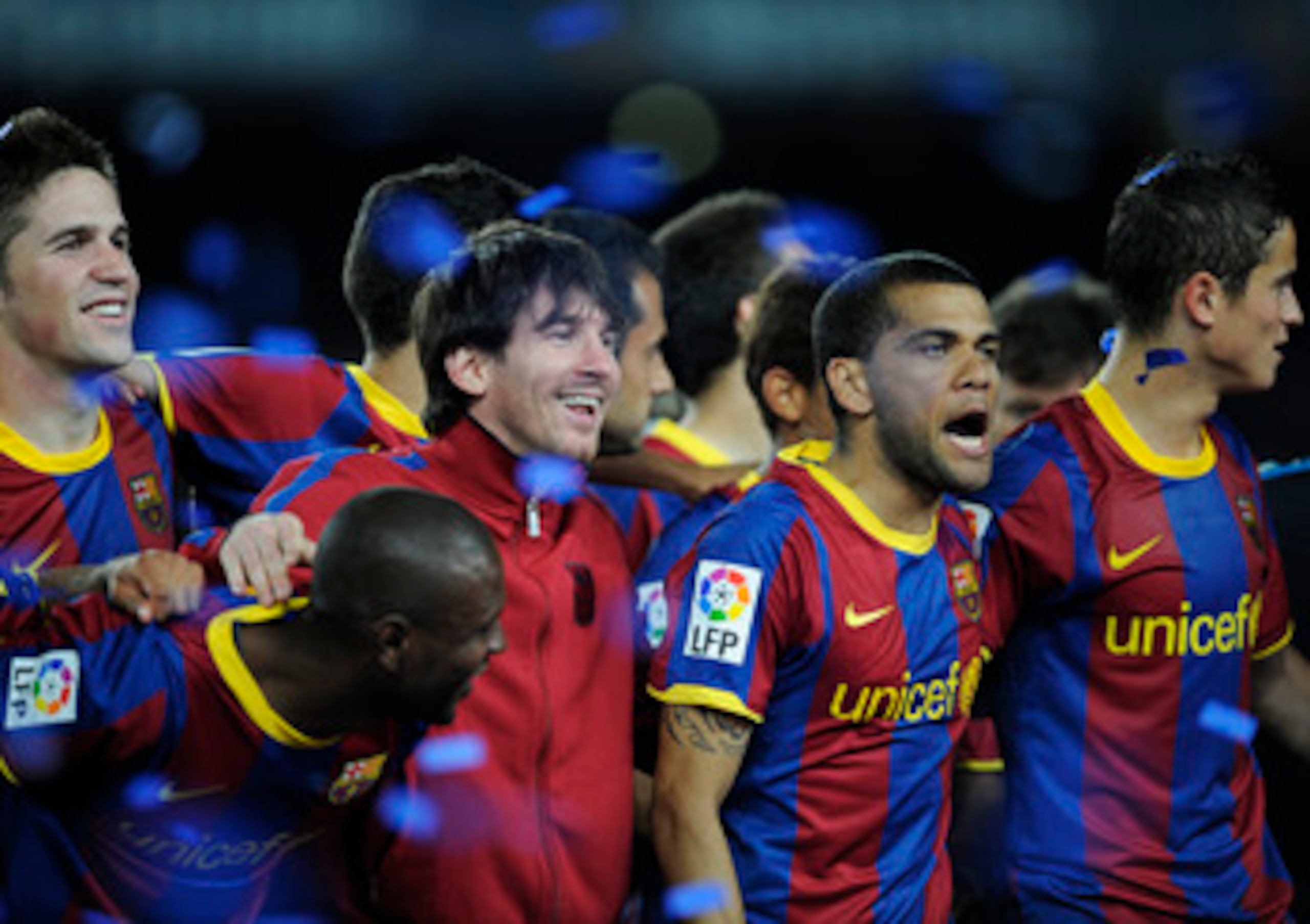 BARCELONA, SPAIN - MAY 15:  Lionel Messi (3rd L) and Dani Alves (2nd R) of FC Barcelona celebrate for winning Liga after the La Liga match between Barcelona and Deportivo La Coruna at Camp Nou Stadium on May 15, 2011 in Barcelona, Spain.  (Photo by David 