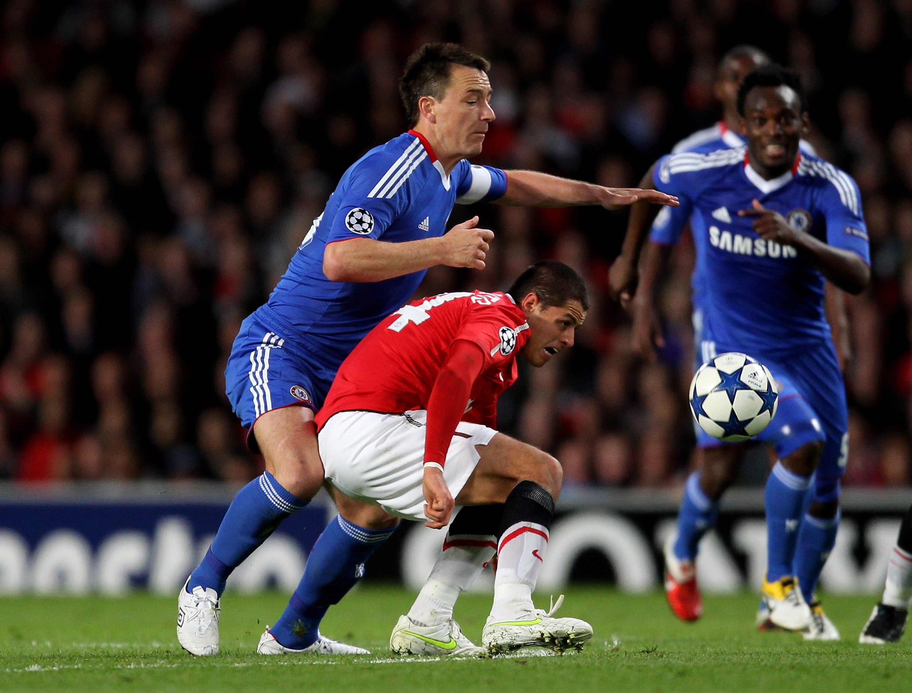 MANCHESTER, ENGLAND - APRIL 12:  Javier Hernandez of Manchester United competes with John Terry of Chelsea during the UEFA Champions League Quarter Final second leg match between Manchester United and Chelsea at Old Trafford on April 12, 2011 in Mancheste