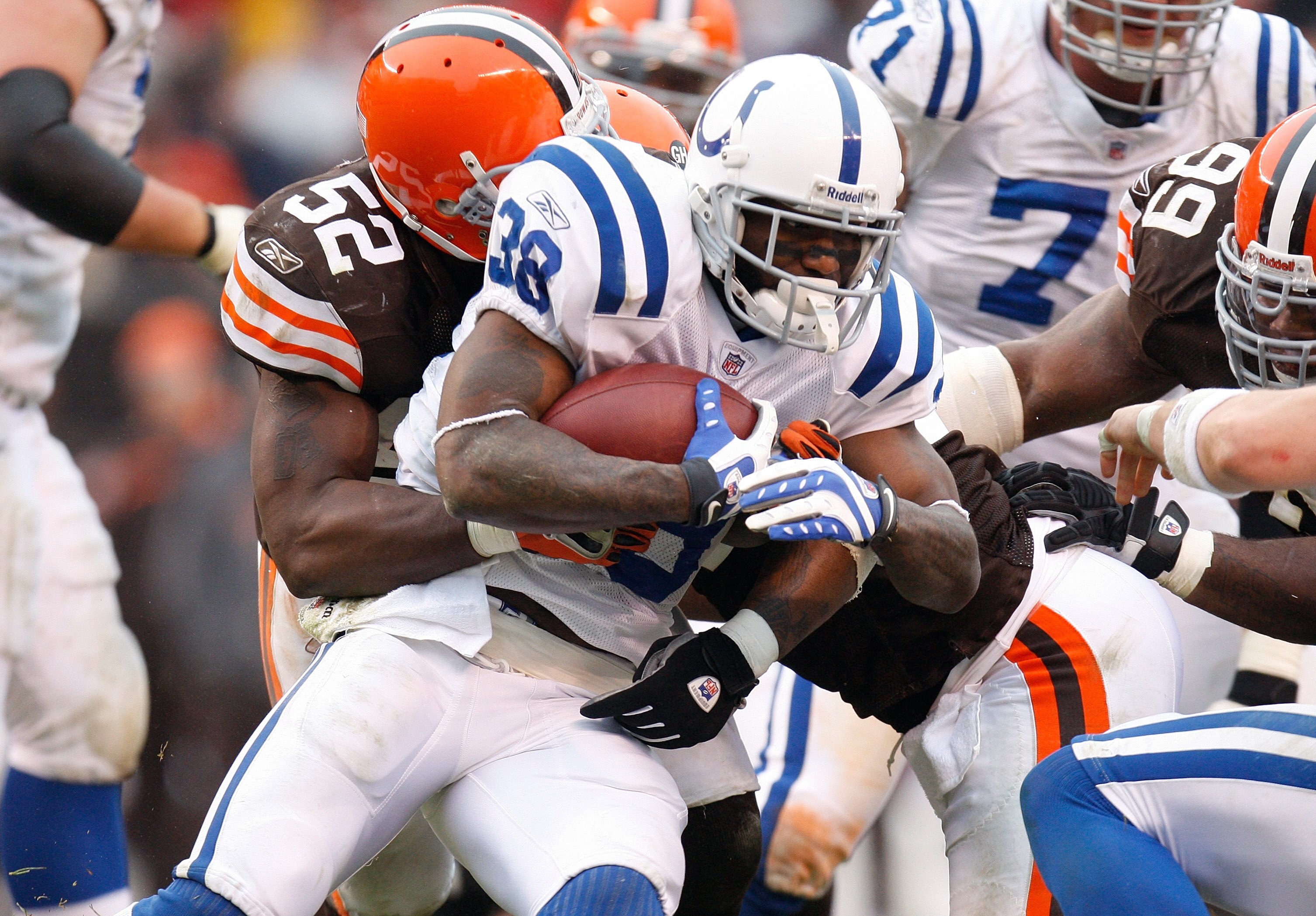 CLEVELAND - NOVEMBER 30:  D'Qwell Jackson #52 of the Cleveland Browns tackles Dominic Rhodes #38 of the Indianapolis Colts during their NFL game on November 30, 2008 at Cleveland Browns Stadium in Cleveland, Ohio. The Colts defeated the Browns 10-6.  (Pho