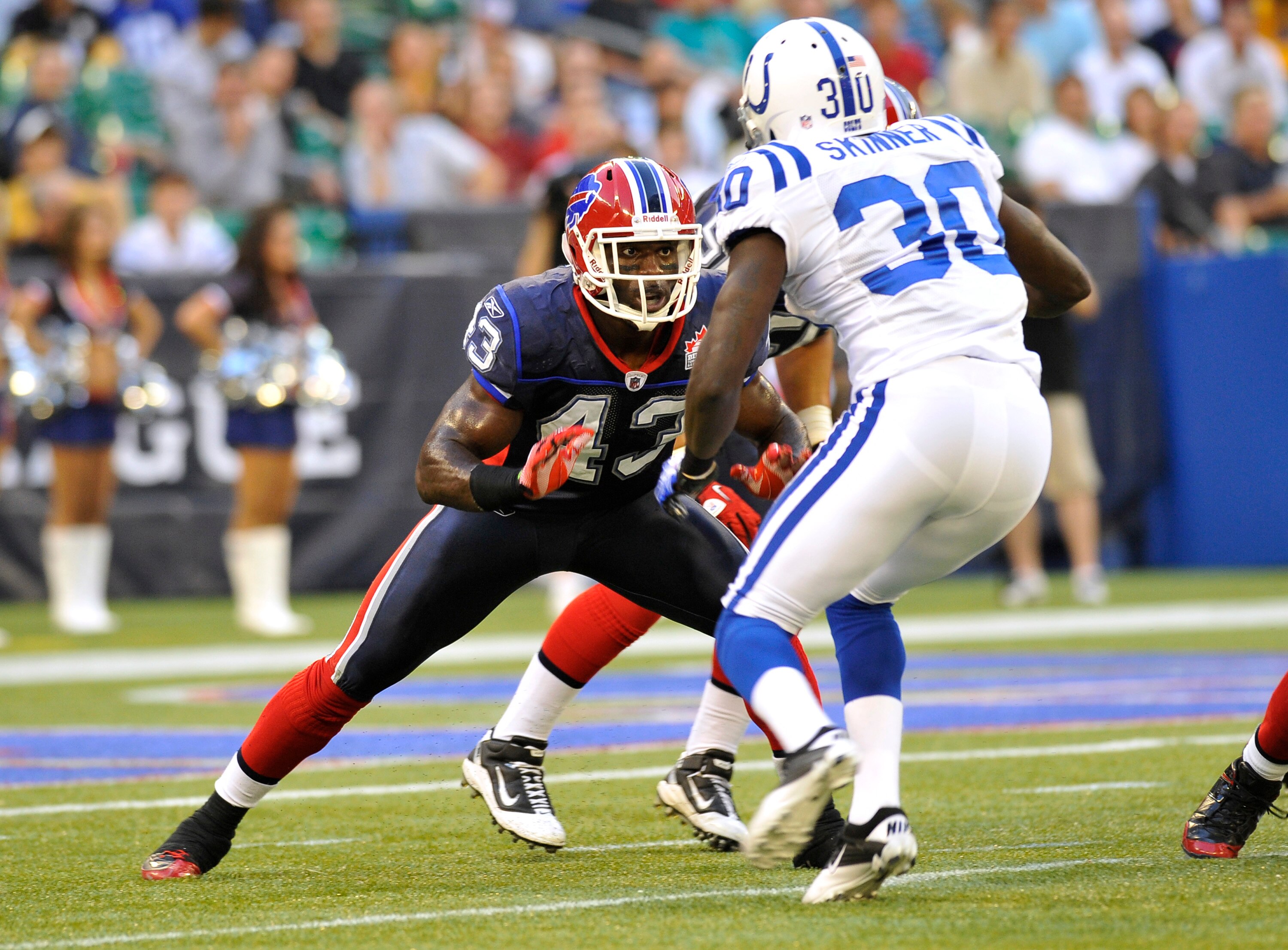 TORONTO, CANADA - AUGUST 19: Bryan Scott #43 of the Buffalo Bills defends against Terrell Skinner #30 of the Indianapolis Colts during game action August 19, 2010 at the Rogers Centre in Toronto, Ontario, Canada. (Photo by Brad White/Getty Images)