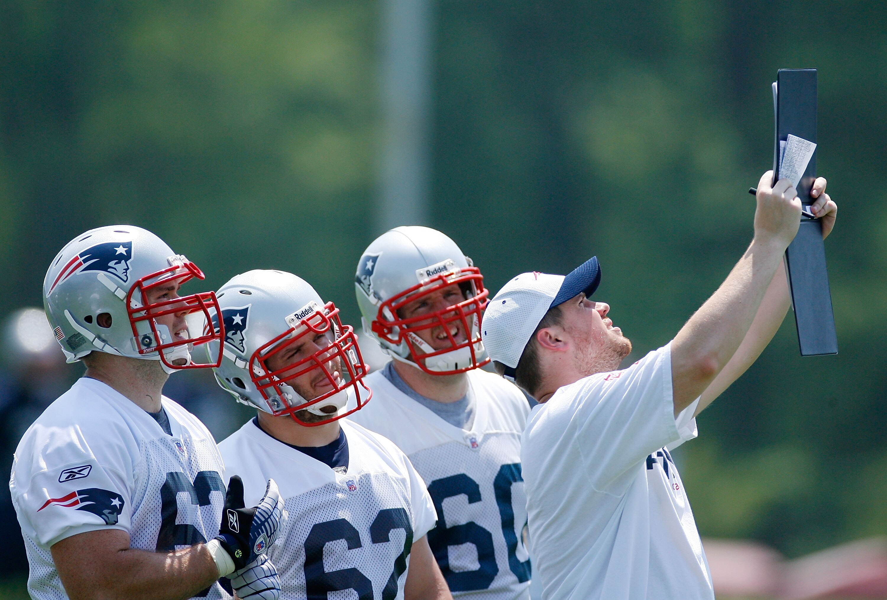 FOXBORO, MA - JUNE 7:  Dan Connolly #63, Ryan Wendell #62 and  Jimmy Martin #60 of the New England Patriots review a play during Mini Camp at Gillette Stadium on June 7, 2008 in Foxboro, Massachusetts. (Photo by Jim Rogash/Getty Images)