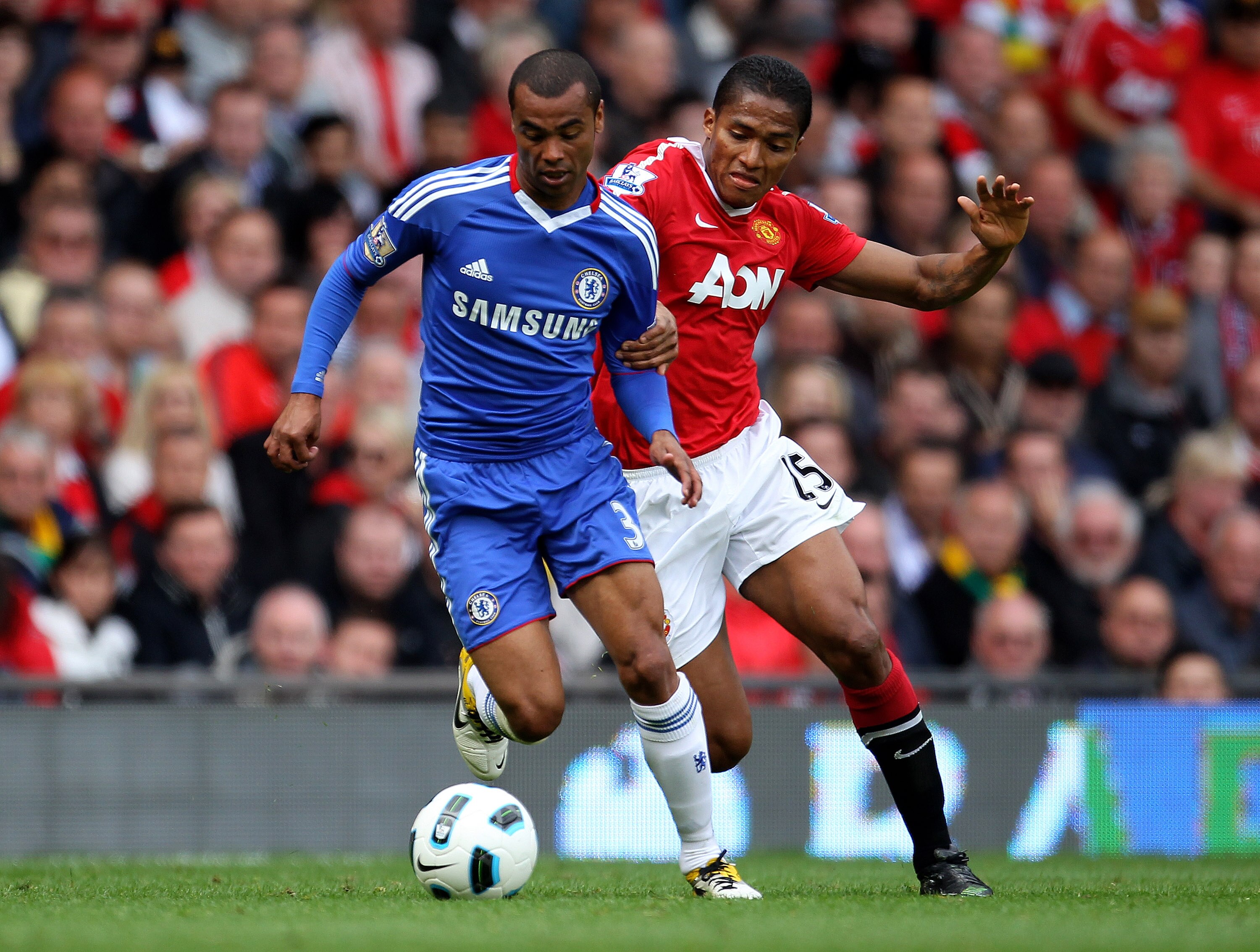 MANCHESTER, ENGLAND - MAY 08:  Antonio Valencia of Manchester United tussles for posession with Ashley Cole of Chelsea during the Barclays Premier League match between Manchester United and Chelsea at Old Trafford on May 8, 2011 in Manchester, England.  (