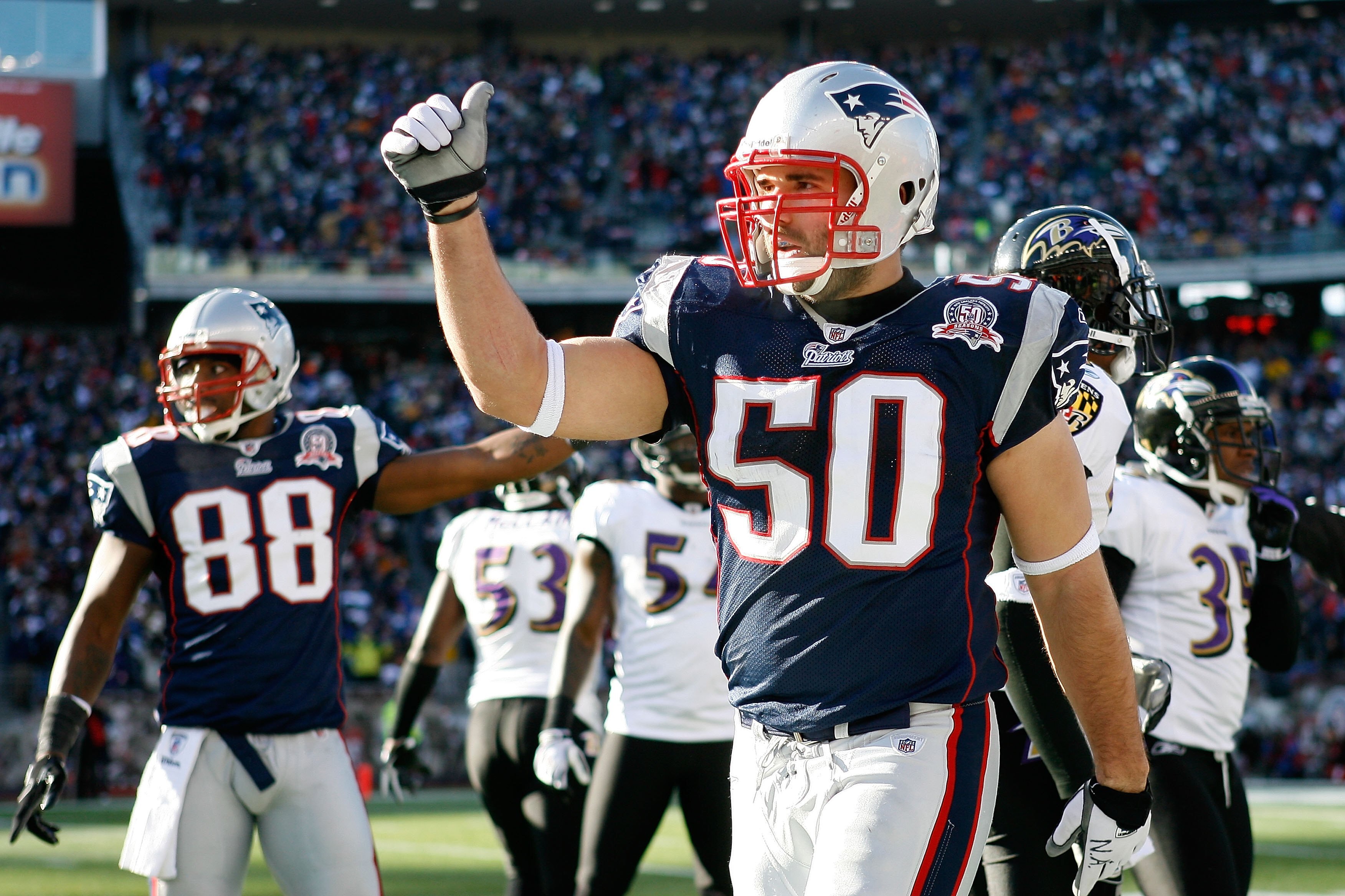 FOXBORO, MA - JANUARY 10:  Rob Ninkovich #50 of the New England Patriots gestures on the field against the Baltimore Ravens during the 2010 AFC wild-card playoff game at Gillette Stadium on January 10, 2010 in Foxboro, Massachusetts.  (Photo by Elsa/Getty