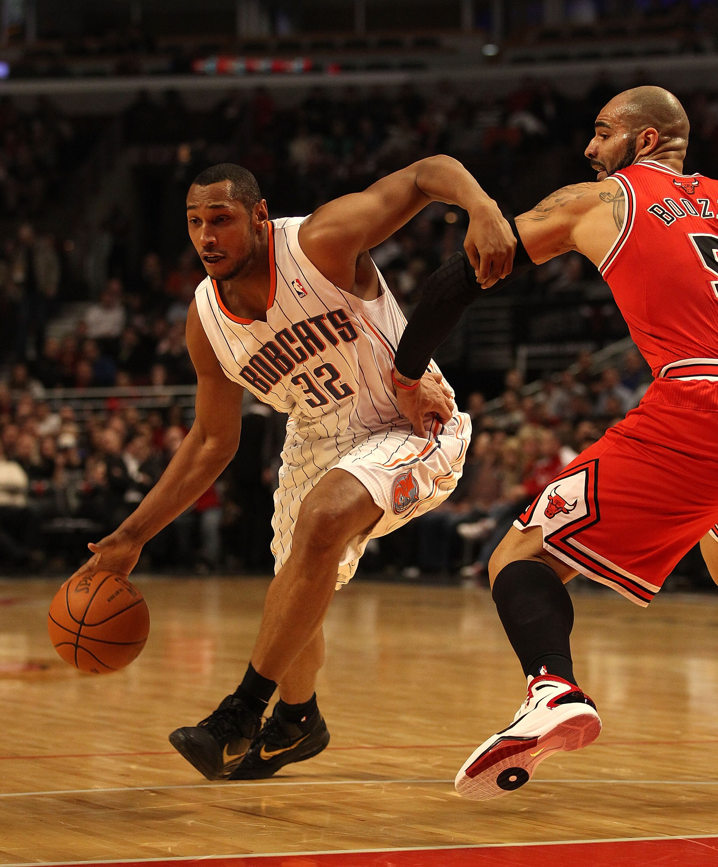 CHICAGO, IL - FEBRUARY 15: Boris Diaw #32 of the Charlotte Bobcats moves around Carlos Boozer #5 of the Chicago Bulls at the United Center on February 15, 2011 in Chicago, Illinois. The Bulls defeated the Bobcats 106-94. NOTE TO USER: User expressly ackno