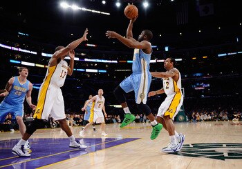 LOS ANGELES, CA - APRIL 03: Raymond Felton #20 of the Denver Nuggets shoots over Andrew Bynum #17 and Shannon Brown #12 of the Los Angeles Lakers during the game at Staples Center on April 3, 2011 in Los Angeles, California. NOTE TO USER: User expressly LOS ANGELES, CA - APRIL 03: Raymond Felton #20 of the Denver Nuggets shoots over Andrew Bynum #17 and Shannon Brown #12 of the Los Angeles Lakers during the game at Staples Center on April 3, 2011 in Los Angeles, California. NOTE TO USER: User expressly