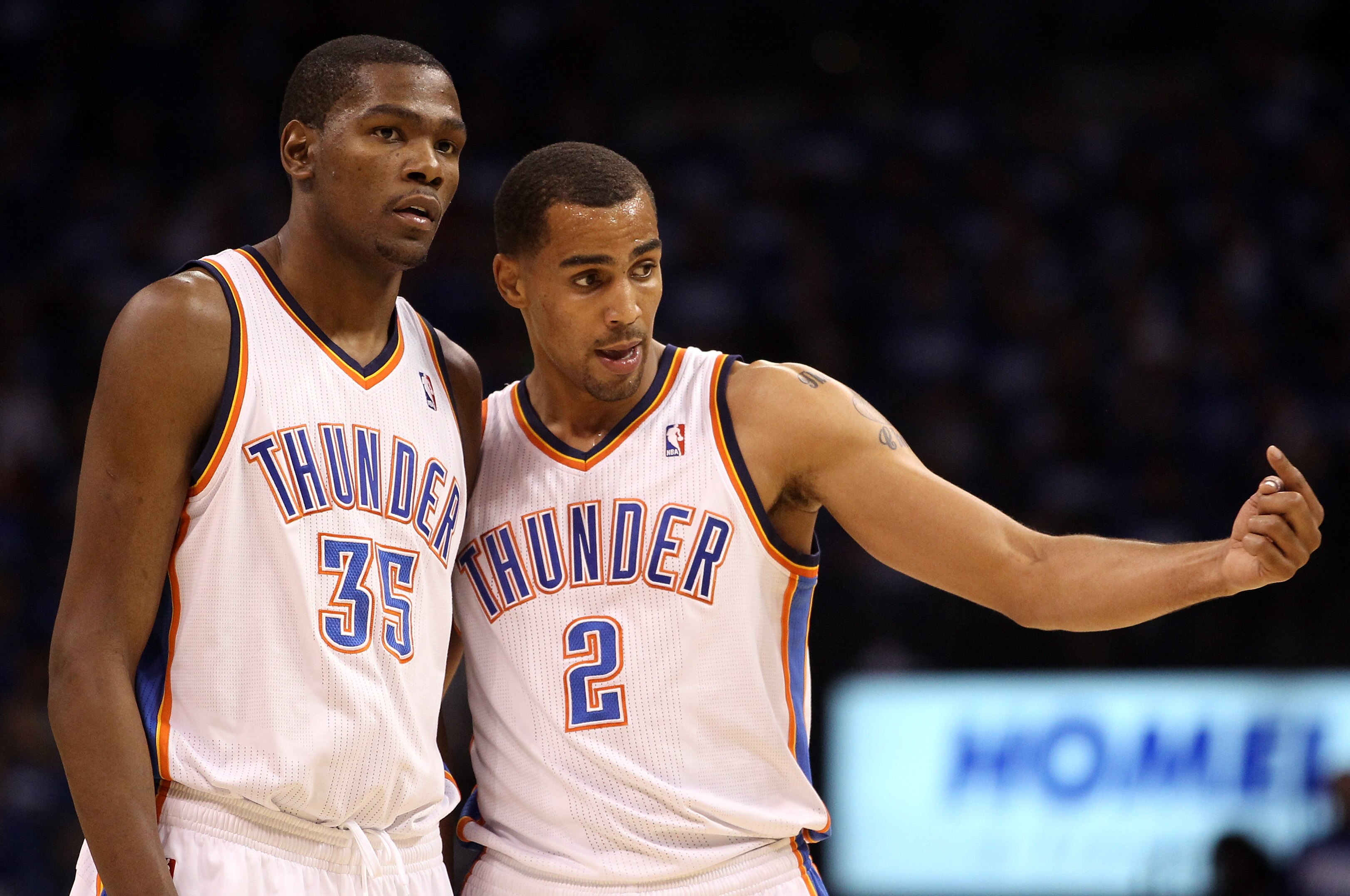 OKLAHOMA CITY, OK - MAY 21:  Kevin Durant #35 and Thabo Sefolosha #2 of the Oklahoma City Thunder talk on the court while taking on the Dallas Mavericks in Game Three of the Western Conference Finals during the 2011 NBA Playoffs at Oklahoma City Arena on