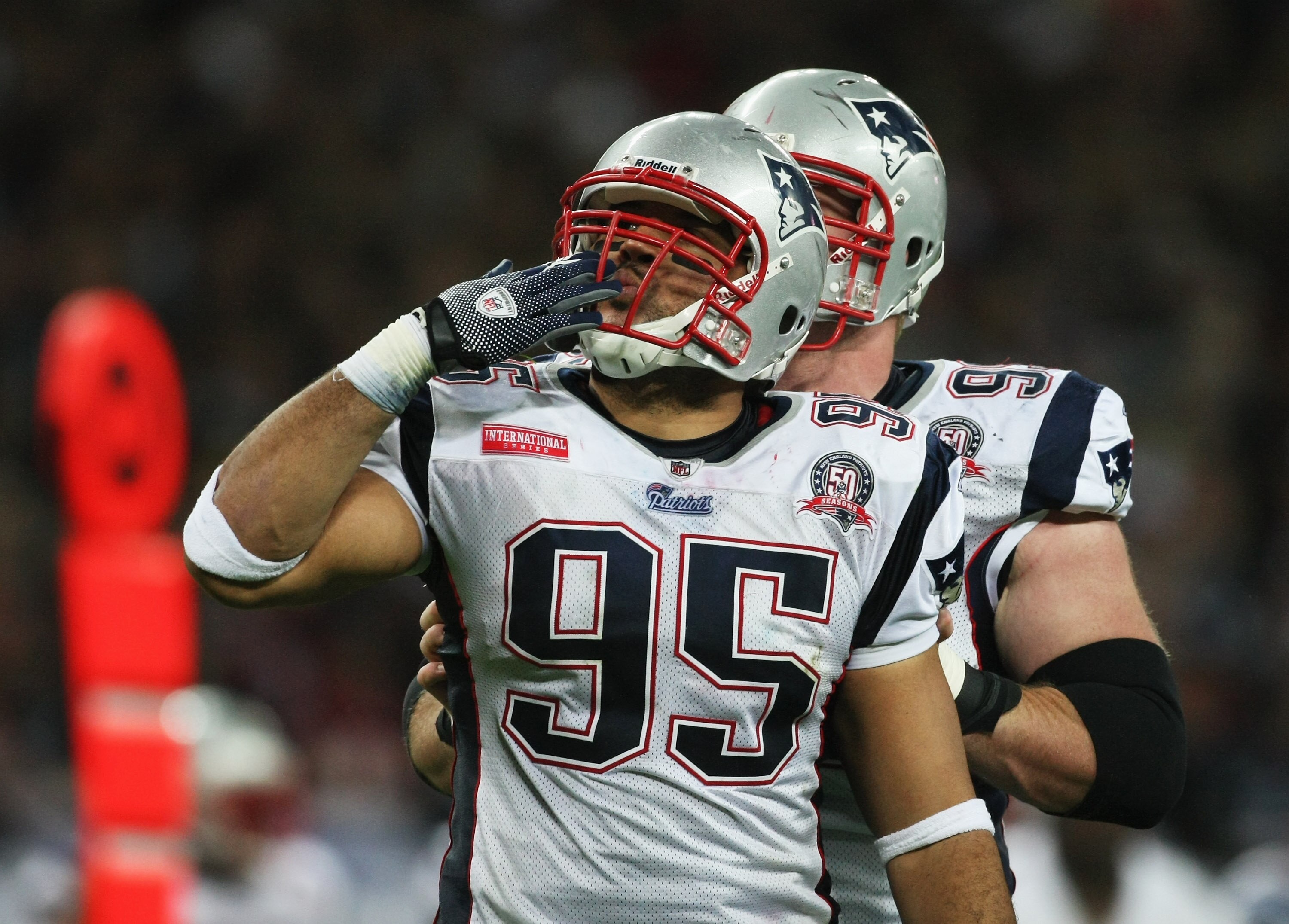 LONDON, ENGLAND - OCTOBER 25:  Tully Banta-Cain (#95) of the New England Patriots celebrates scoring the fourth touchdown during the NFL International Series match between New England Patriots and Tampa Bay Buccaneers at Wembley Stadium on October 25, 200