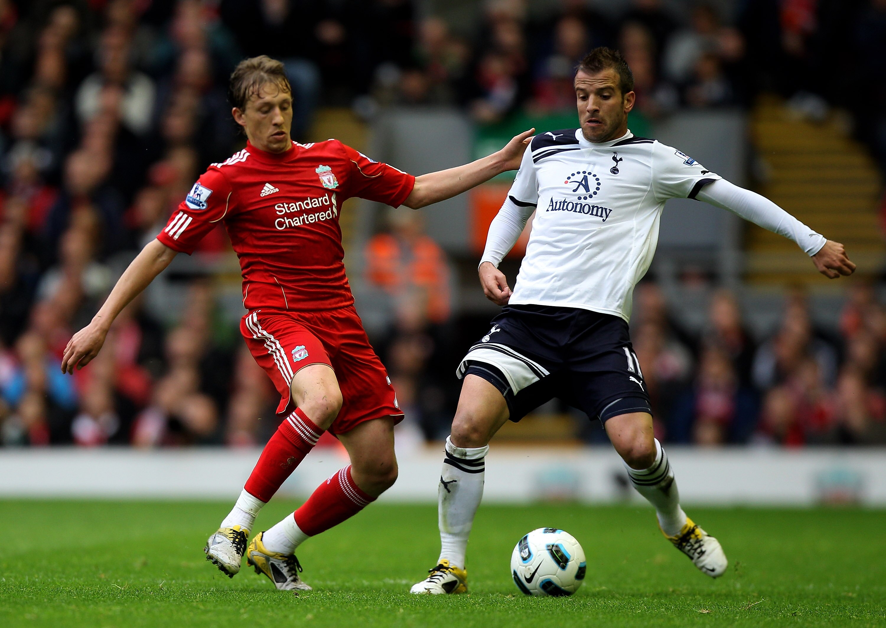 LIVERPOOL, ENGLAND - MAY 15:  Lucas of Liverpool and Rafael Van der Vaart of Spurs compete for the ball during the Barclays Premier League match between Liverpool and Tottenham Hotspur at Anfield on May 15, 2011 in Liverpool, England.  (Photo by Michael S