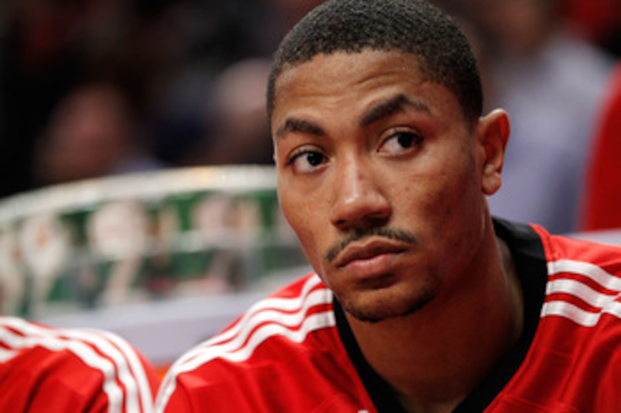 CHICAGO, IL - MAY 18:  Derrick Rose #1 of the Chicago Bulls looks on from the bench against the Chicago Bulls in Game Two of the Eastern Conference Finals during the 2011 NBA Playoffs on May 18, 2011 at the United Center in Chicago, Illinois. The Heat won