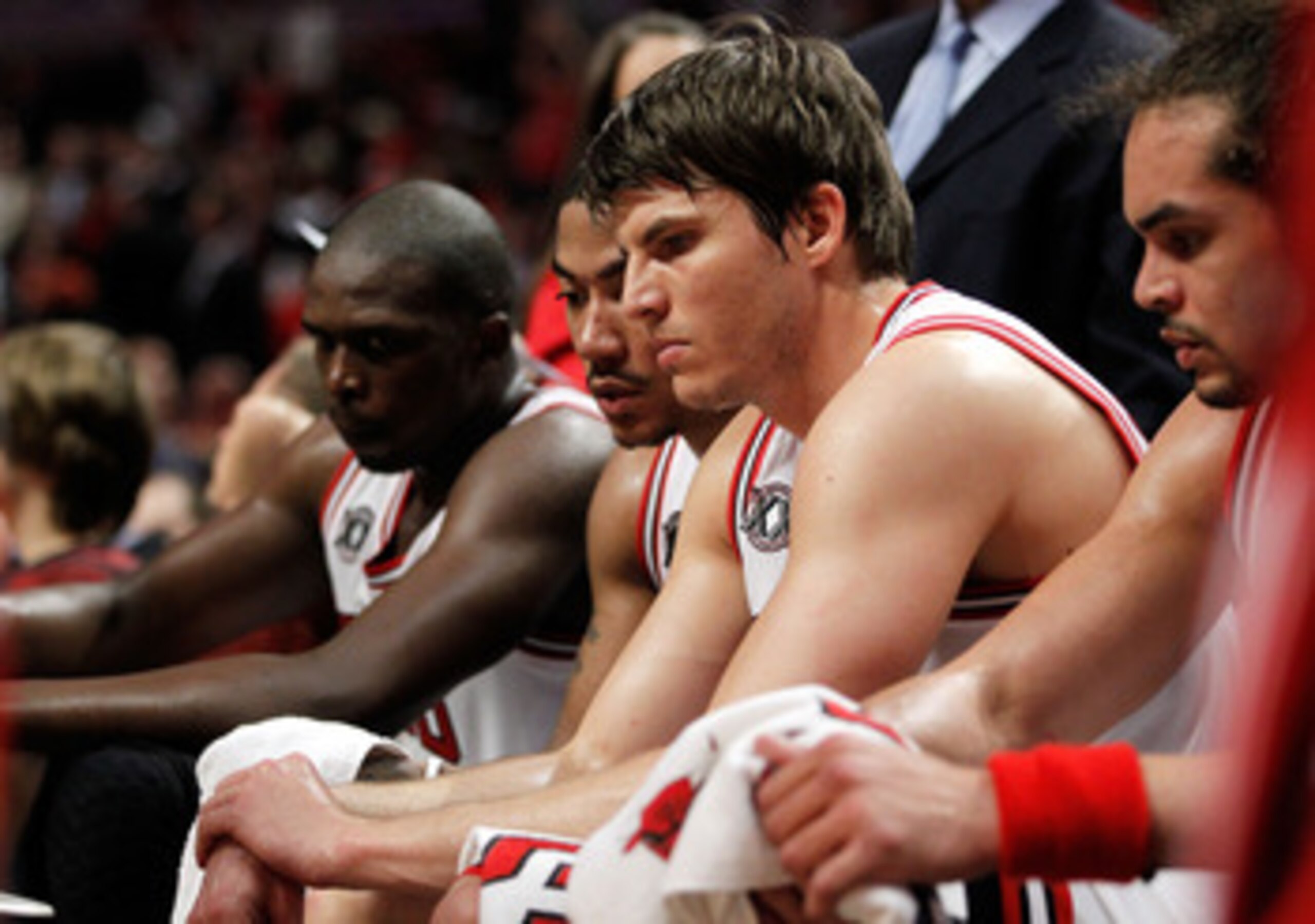 CHICAGO, IL - MAY 18:  (L-R) Luol Deng #9, Derrick Rose #1, Kyle Korver #26 and Joakim Noah #13 of the Chicago Bulls look on dejected from the bench late in the fourth quarter against the Miami Heat in Game Two of the Eastern Conference Finals during the