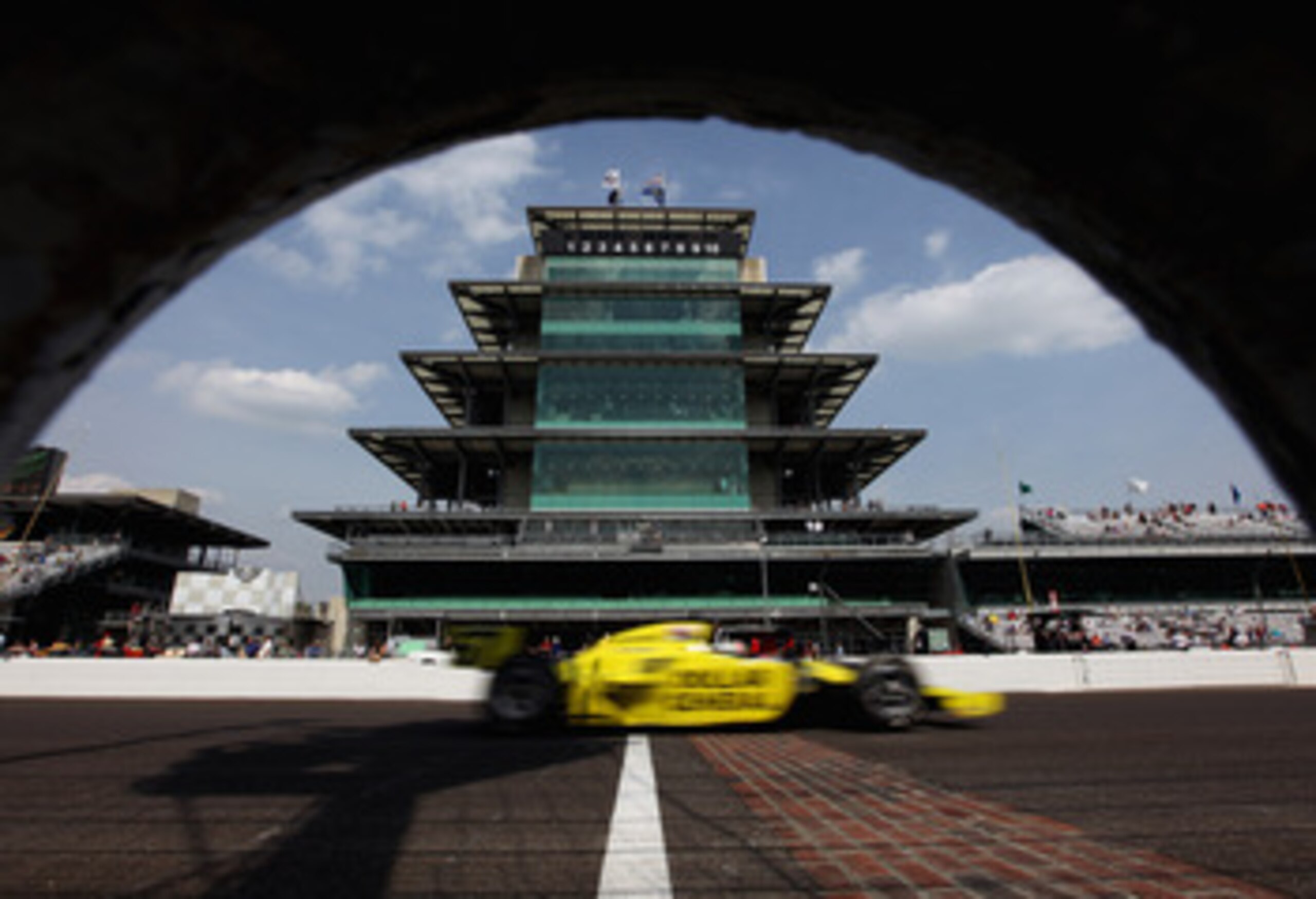 INDIANAPOLIS, IN - MAY 20:  Ed Carpenter, driver of the #67 Dollar General/Srah Fisher Racing Dallara Honda, passes the pagoda on the front stretch during practice for the Indianapolis 500 on May 20, 2011 at Indianapolis Motor Speedway in Indianapolis, In