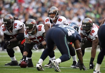 SEATTLE - DECEMBER 20:  Center Jeff Faine #52 of the Tampa Bay Buccaneers waits to snap the ball to quarterback Josh Freeman #5 during their game against the Seattle Seahawks on December 20, 2009 at Qwest Field in Seattle, Washington. The Buccaneers defea