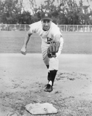 UNDATED:  Phil Rizzuto #10 of the New York Yankees poses for an action portrait.  Rizzuto played for the New York Yankees from 1941-1956.  (Photo by Bruce Bennett Studios/Getty Images)