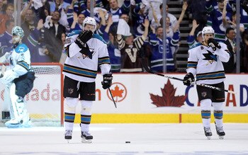VANCOUVER, CANADA - MAY 18:  Antti Niemi #31, Dany Heatley #15 and Joe Pavelski #8 of the San Jose Sharks look on after a goal by Daniel Sedin #22 of the Vancouver Canucks in the third period in Game Two of the Western Conference Finals during the 2011 St