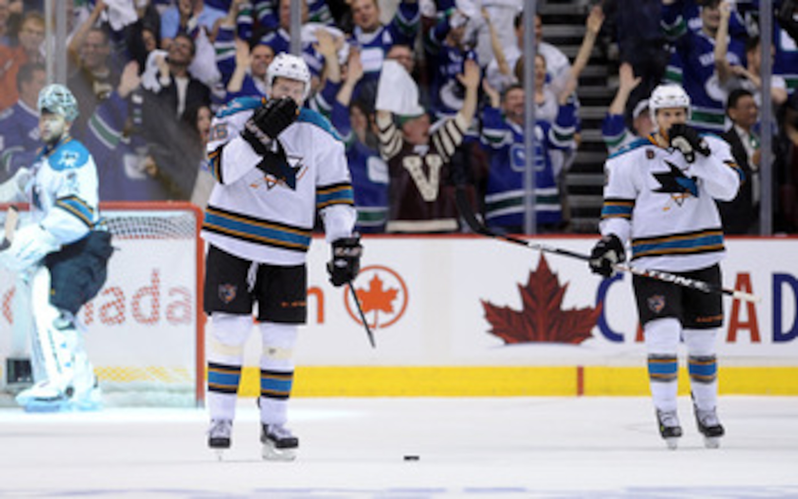 VANCOUVER, CANADA - MAY 18:  Antti Niemi #31, Dany Heatley #15 and Joe Pavelski #8 of the San Jose Sharks look on after a goal by Daniel Sedin #22 of the Vancouver Canucks in the third period in Game Two of the Western Conference Finals during the 2011 St