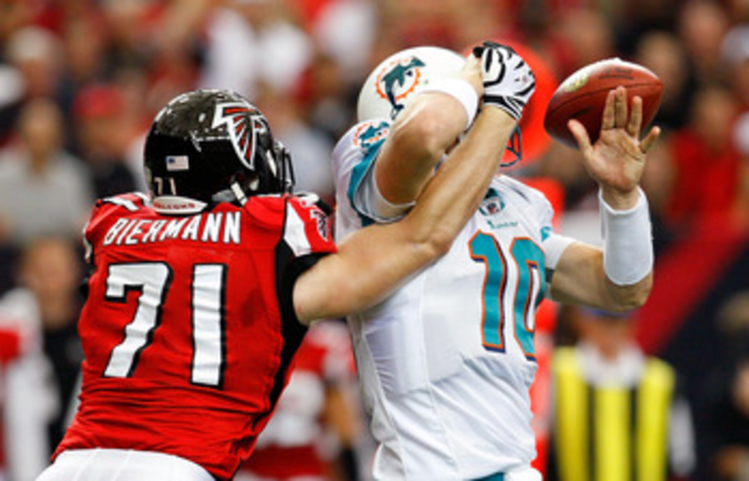 ATLANTA - SEPTEMBER 13:  Kroy Biermann #71 of the Atlanta Falcons forces a fumble by quarterback Chad Pennington #10 of the Miami Dolphins at Georgia Dome on September 13, 2009 in Atlanta, Georgia.  (Photo by Kevin C. Cox/Getty Images)