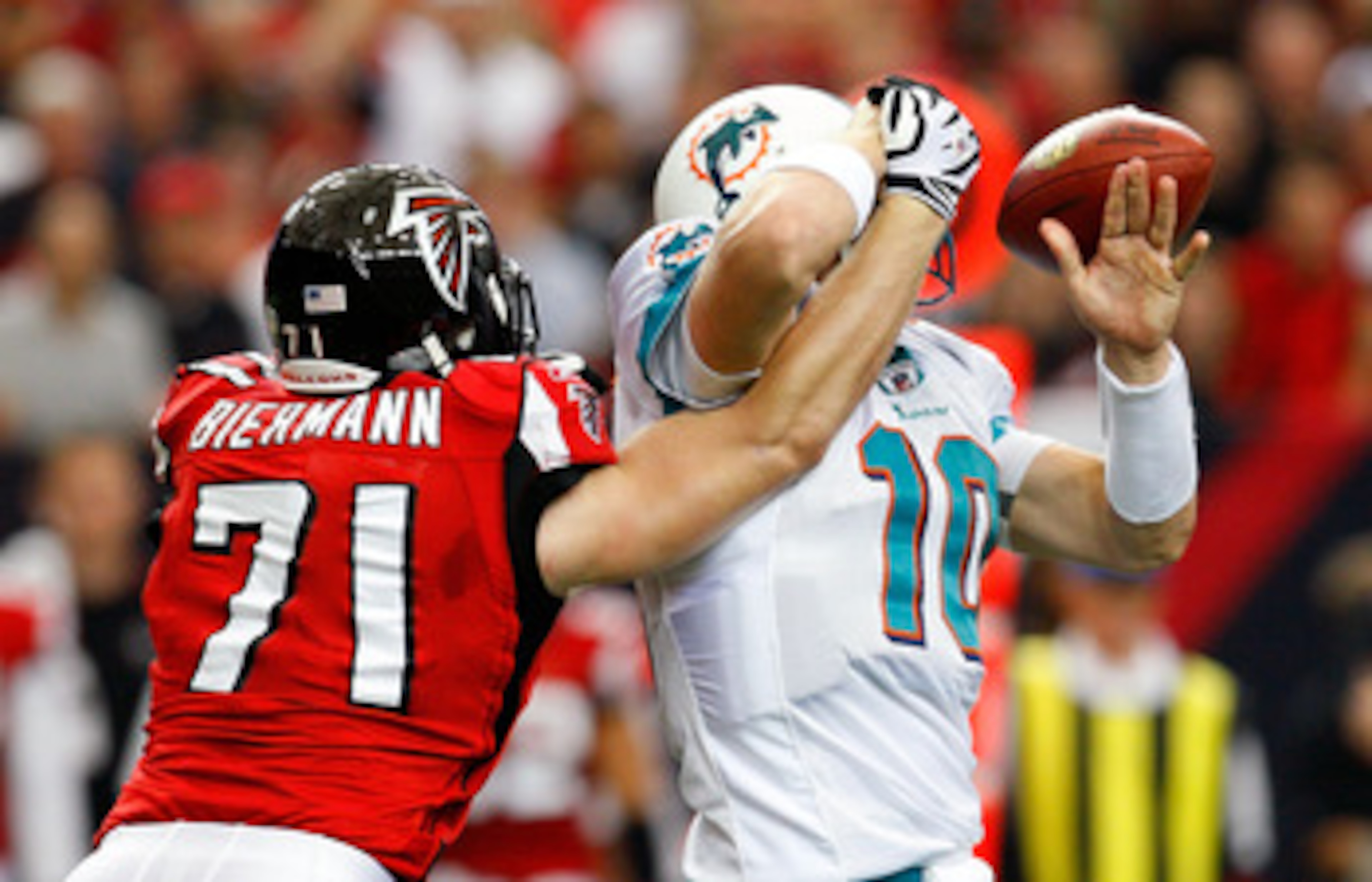 ATLANTA - SEPTEMBER 13:  Kroy Biermann #71 of the Atlanta Falcons forces a fumble by quarterback Chad Pennington #10 of the Miami Dolphins at Georgia Dome on September 13, 2009 in Atlanta, Georgia.  (Photo by Kevin C. Cox/Getty Images)