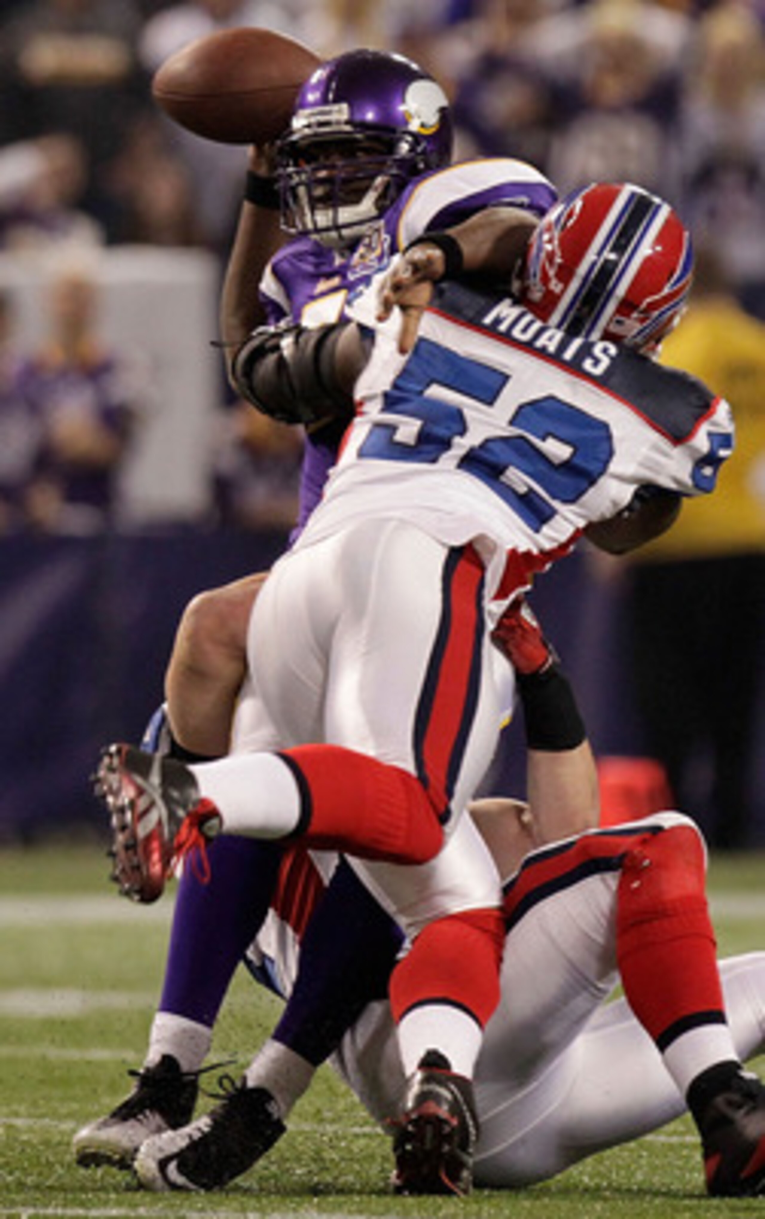 MINNEAPOLIS, MN - DECEMBER 05: Tavaris Jackson #7 of the Minnesota Vikings is sacked by Paul Posluszny #51 and Arthur Moats #52 of the Buffalo Bills at the Mall of America Field at the Hubert H. Humphrey Metrodome on December 5, 2010 in Minneapolis, Minne
