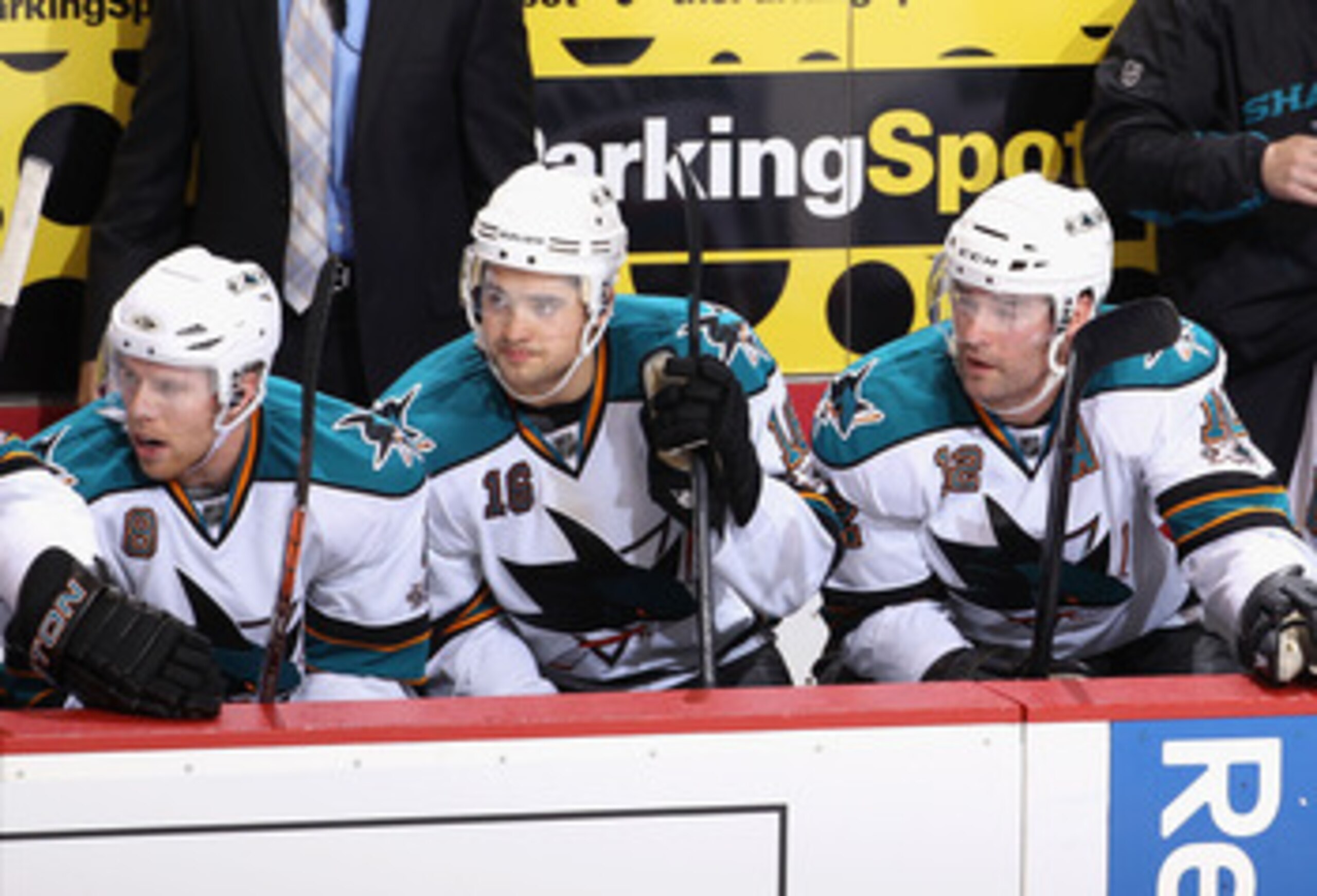 GLENDALE, AZ - JANUARY 17:  (L-R) Joe Pavelski #8, Devin Setoguchi #16 and Patrick Marleau #12 of the San Jose Sharks watch from the bench during the NHL game against the Phoenix Coyotes at Jobing.com Arena on January 17, 2011 in Glendale, Arizona.  The S
