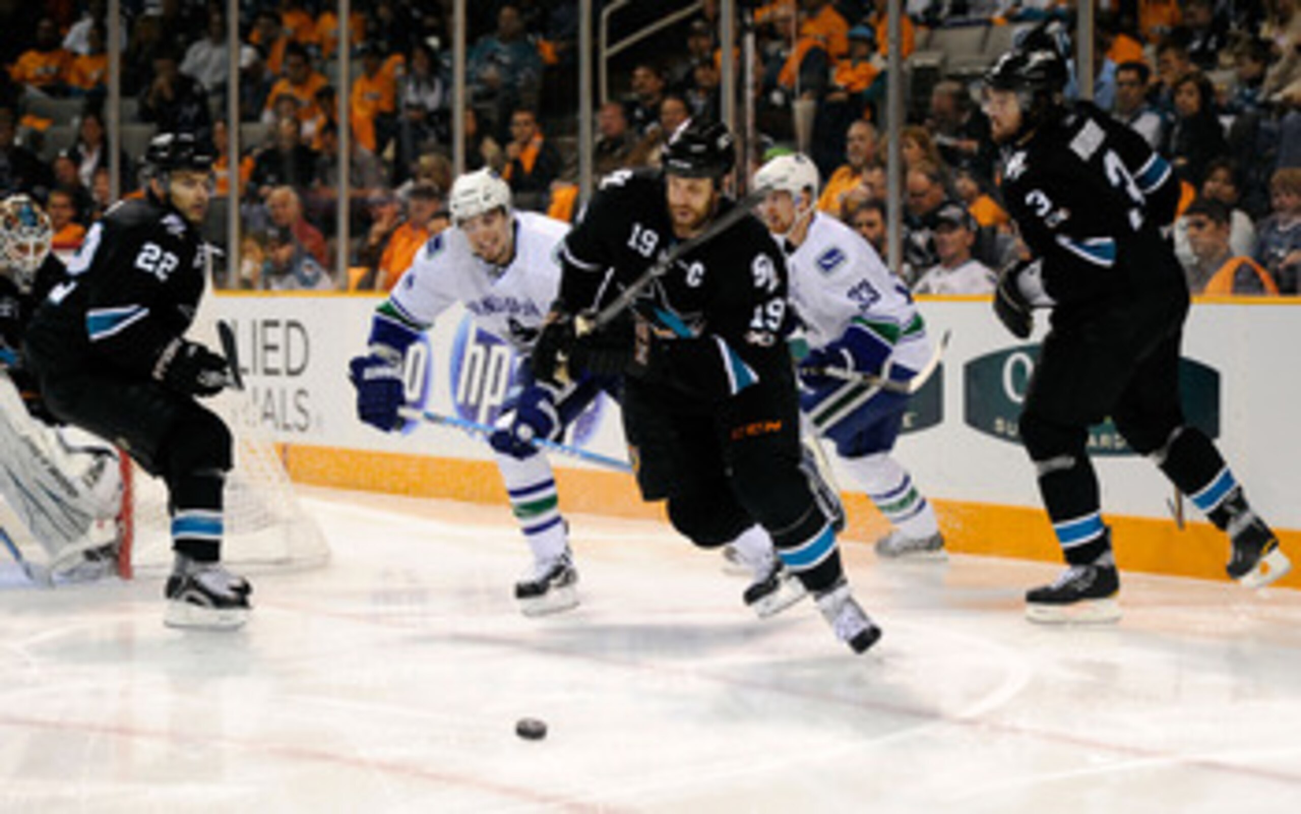SAN JOSE, CA - MAY 20:  Joe Thornton #19 of the San Jose Sharks looks to clear the puck out of the defensive zone in Game Three of the Western Conference Finals against the Vancouver Canucks  during the 2011 Stanley Cup Playoffs at HP Pavilion on May 20, 