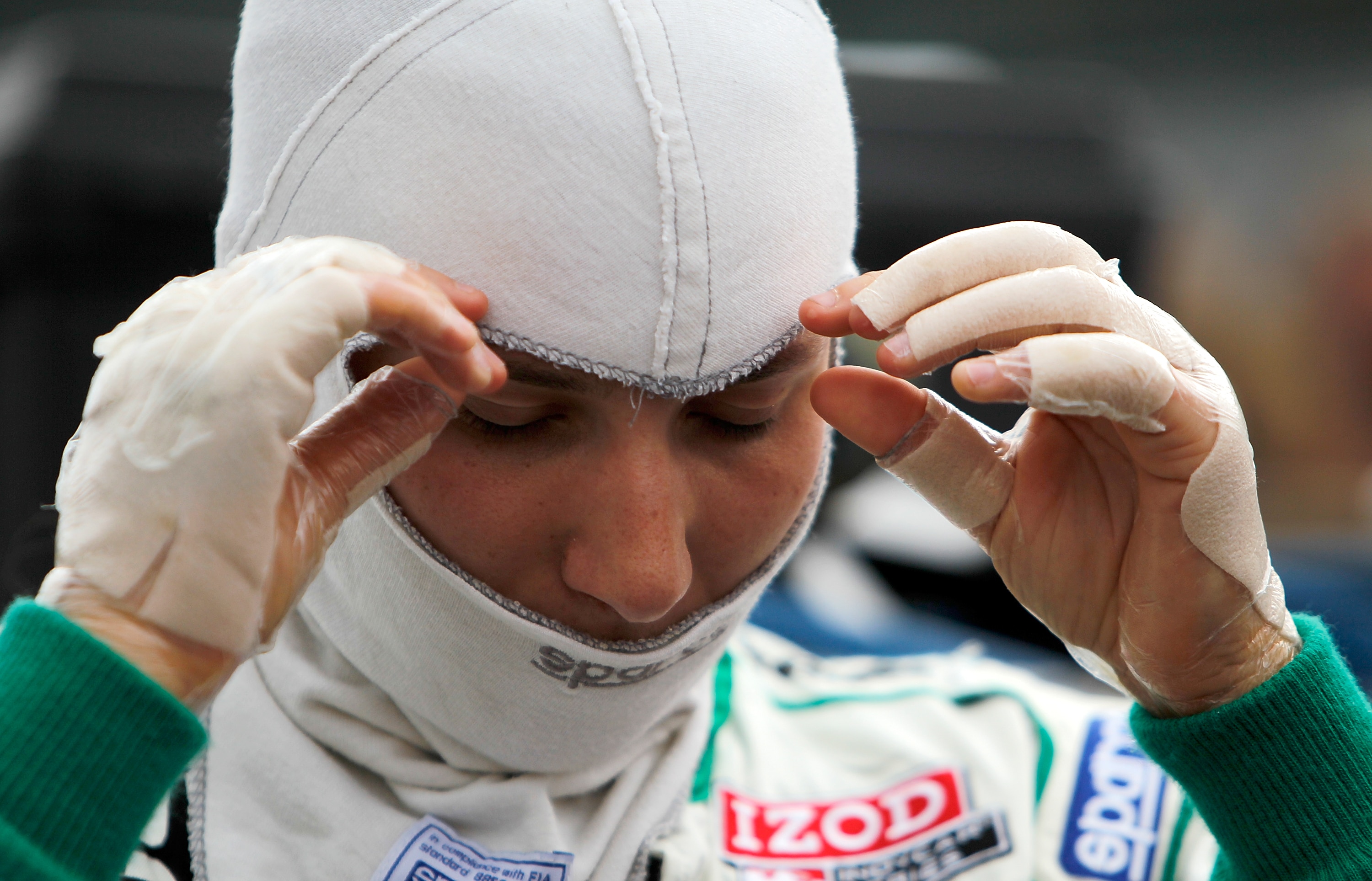 INDIANAPOLIS - MAY 21:  Simona De Silvestro, with bandages on her hands after suffering burns from a crash, prepares to qualify her #78 Nuclear Clean Air Energy HVM Racing Dallara Honda for the 95th Indianapolis 500 Mile Race at the Indianapolis Motor Spe