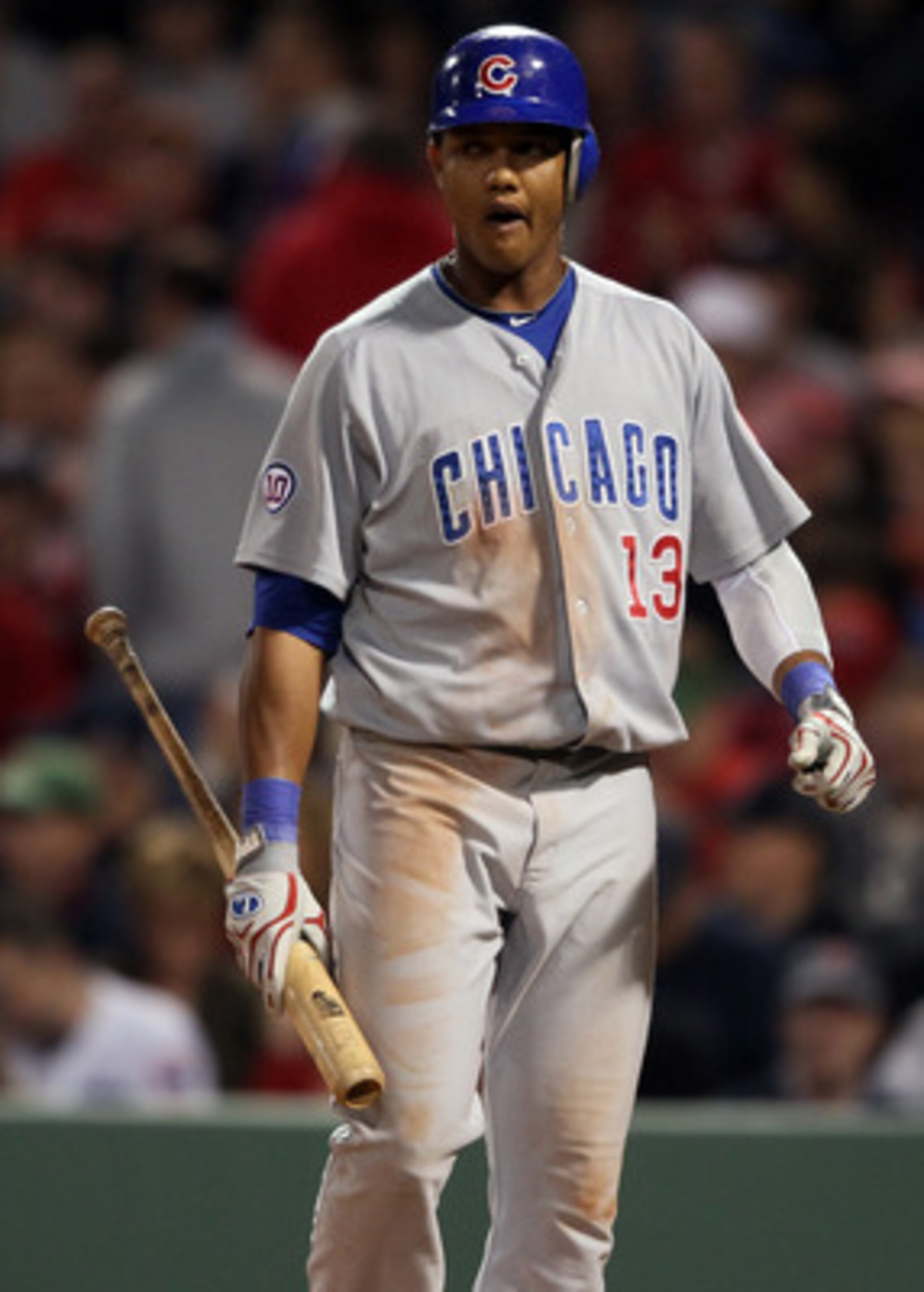 BOSTON, MA - MAY 20: Starlin Castro #13 of the Chicago Cubs reacts after he struck out against the Boston Red Sox on May 20, 2011 at Fenway Park in Boston, Massachusetts.on May 20, 2011 at Fenway Park in Boston, Massachusetts. The Chicago Cubs and the Bo BOSTON, MA - MAY 20: Starlin Castro #13 of the Chicago Cubs reacts after he struck out against the Boston Red Sox on May 20, 2011 at Fenway Park in Boston, Massachusetts.on May 20, 2011 at Fenway Park in Boston, Massachusetts. The Chicago Cubs and the Bo