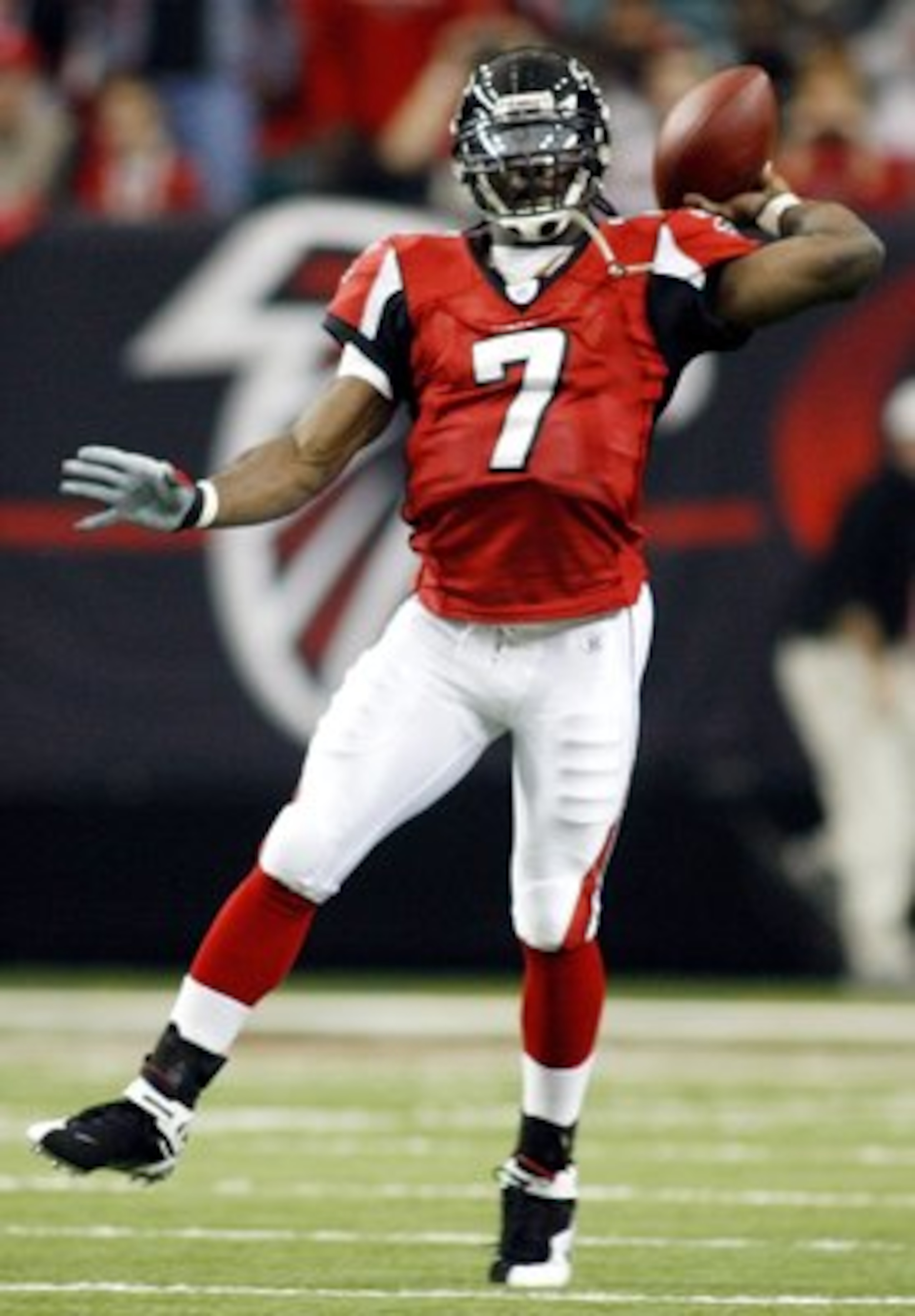 ATLANTA - DECEMBER 24:    Quarterback Michael Vick #7 of the Atlanta Falcons thows the ball against the Carolina Panthers December 24, 2006 at The Georgia Dome  in Atlanta,Georgia  (Photo by Marc Serota/Getty Images)