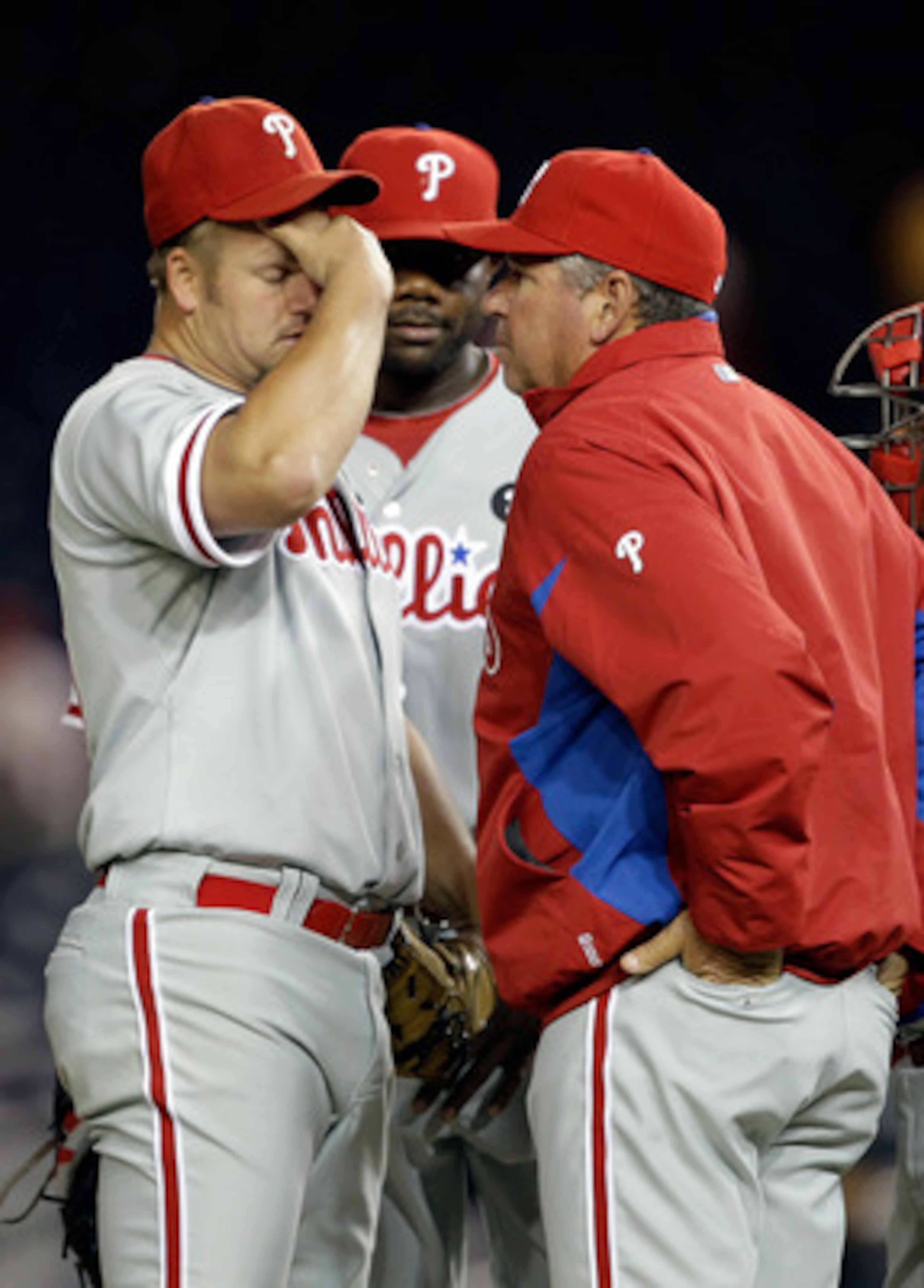 WASHINGTON, DC - APRIL 12:  Starting pitcher Joe Blanton #56 of the Philadelphia Phillies (L) talks with pitching coach Rich Dubee (R) during the fourth inning against the Washington Nationals at Nationals Park on April 12, 2011 in Washington, DC.  (Photo