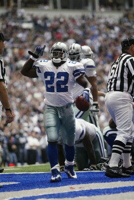 IRVING, TX - OCTOBER 27:   Running Back Emmitt Smith #22 of the Dallas Cowboys celebrates beating the NFL rushing record  during the NFL game against the Seattle Seahawks at Texas Stadium on October 27, 2002 in Irving, Texas. The Seahawks defeated the Cow