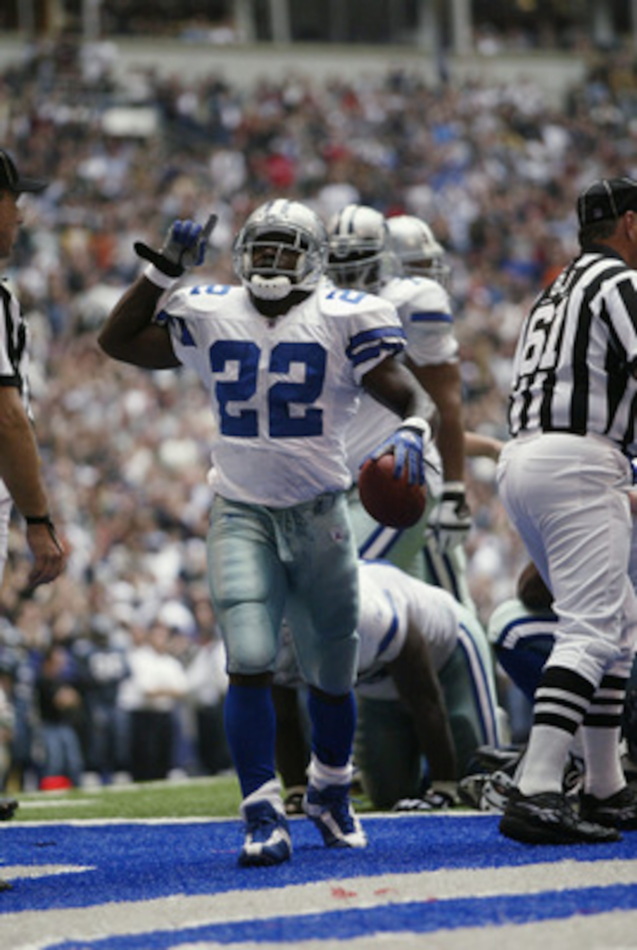 IRVING, TX - OCTOBER 27:   Running Back Emmitt Smith #22 of the Dallas Cowboys celebrates beating the NFL rushing record  during the NFL game against the Seattle Seahawks at Texas Stadium on October 27, 2002 in Irving, Texas. The Seahawks defeated the Cow