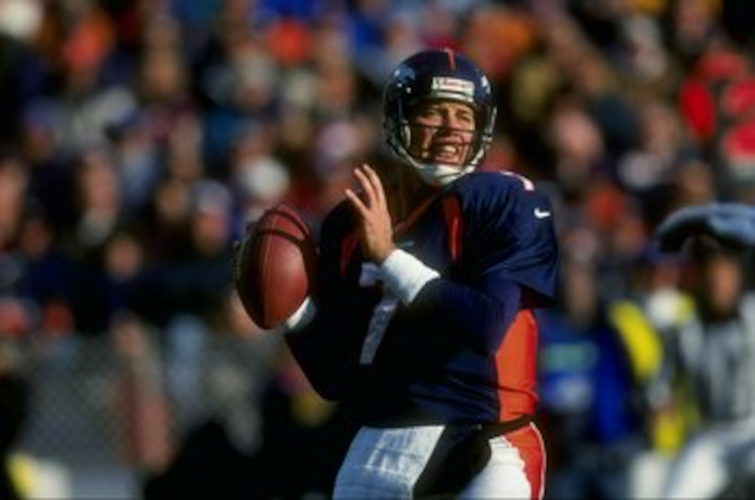 6 Dec 1998: Quarterback John Elway #7 of the Denver Broncos in action during the game against the Kansas City Chiefs at Mile High Stadium in Denver, Colorado. The Broncos defeated the Chiefs 35-31.