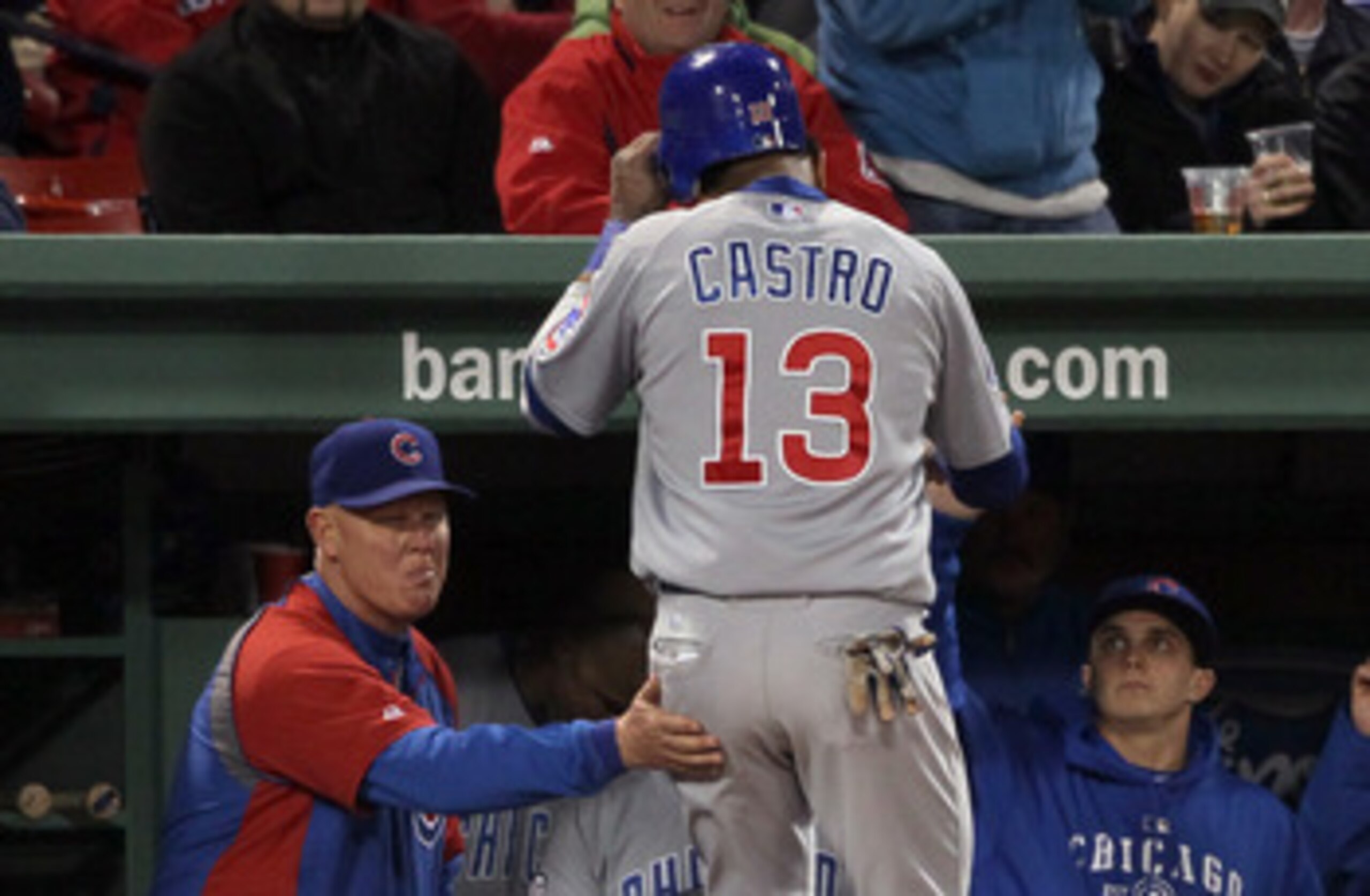 BOSTON, MA - MAY 22:  Starlin Castro #13 of the Chicago Cubs is congratulated by manager Mike Quade #8 after Castro scored in the seventh inning against the Boston Red Sox on May 22, 2011 at Fenway Park in Boston, Massachusetts.  Before this series, the t