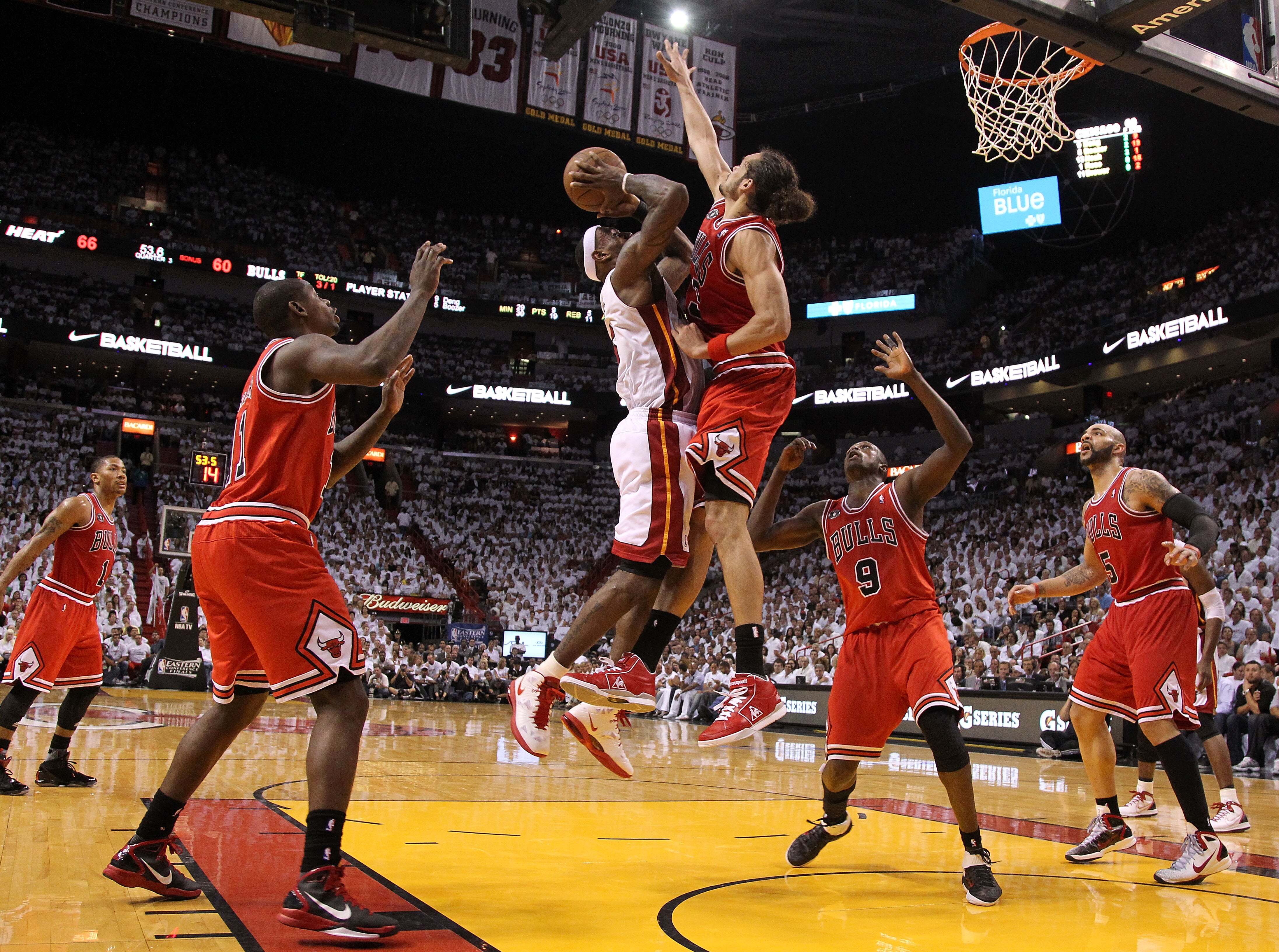 MIAMI, FL - MAY 22:  LeBron James #6 of the Miami Heat drives for a shot attempt against Joakim Noah #13 of the Chicago Bulls in Game Three of the Eastern Conference Finals during the 2011 NBA Playoffs on May 22, 2011 at American Airlines Arena in Miami,