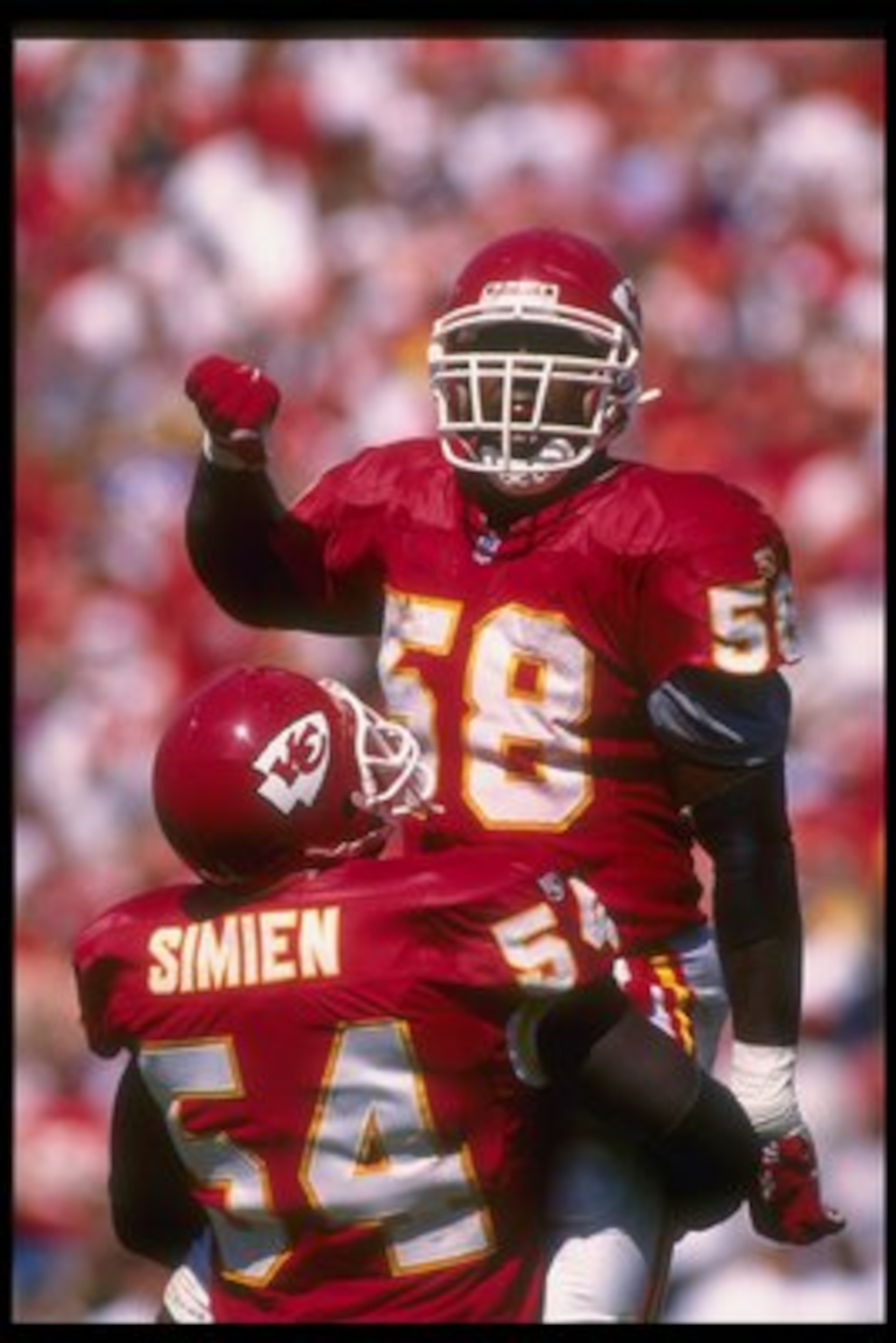10 Sep 1995: Kansas City Chiefs linebackers Derrick Thomas (right) and Tracy Simien celebrate during a game against the New York Giants at Arrowhead Stadium in Kansas City, Missouri. The Chiefs won the game, 21-17.