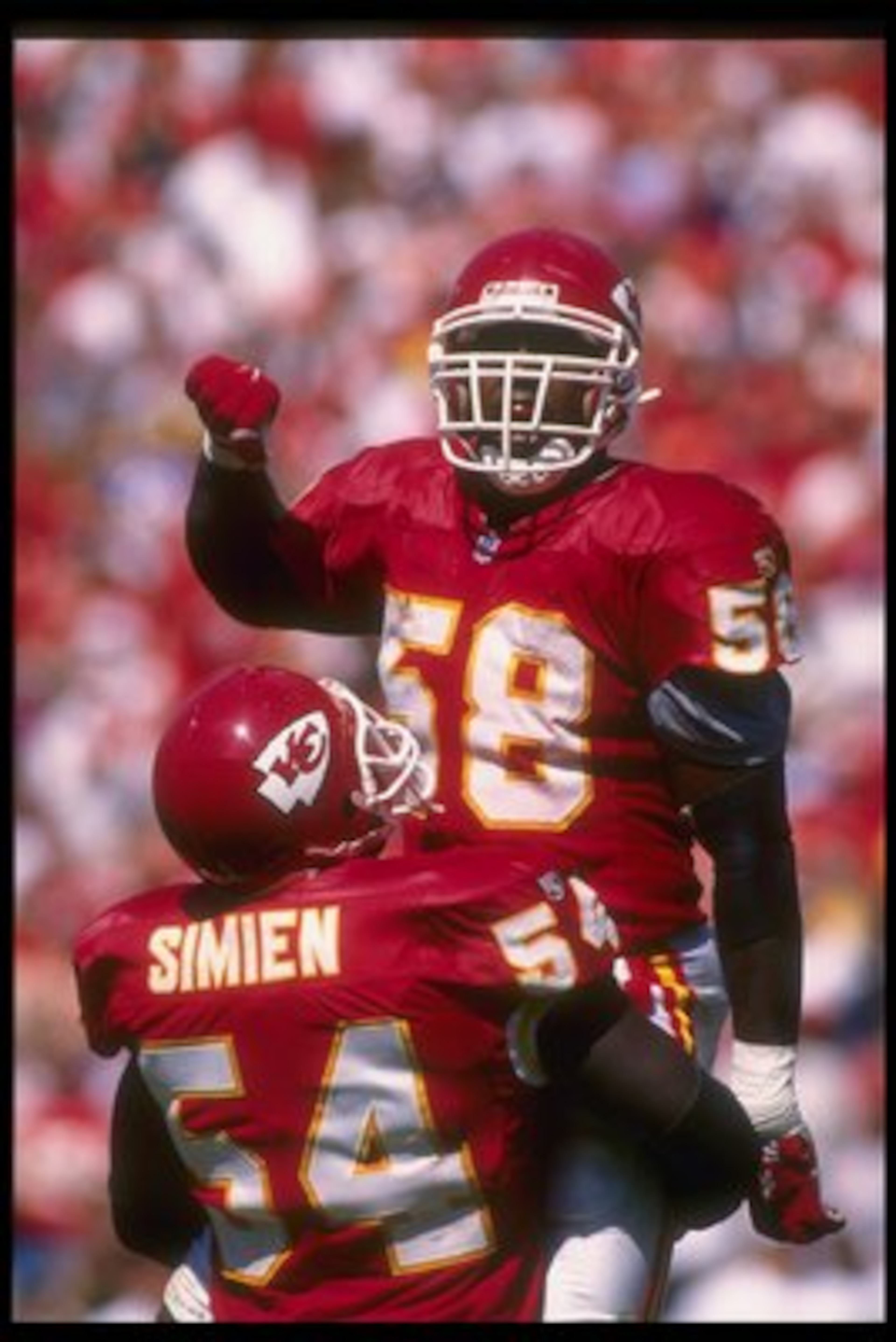 10 Sep 1995: Kansas City Chiefs linebackers Derrick Thomas (right) and Tracy Simien celebrate during a game against the New York Giants at Arrowhead Stadium in Kansas City, Missouri. The Chiefs won the game, 21-17.