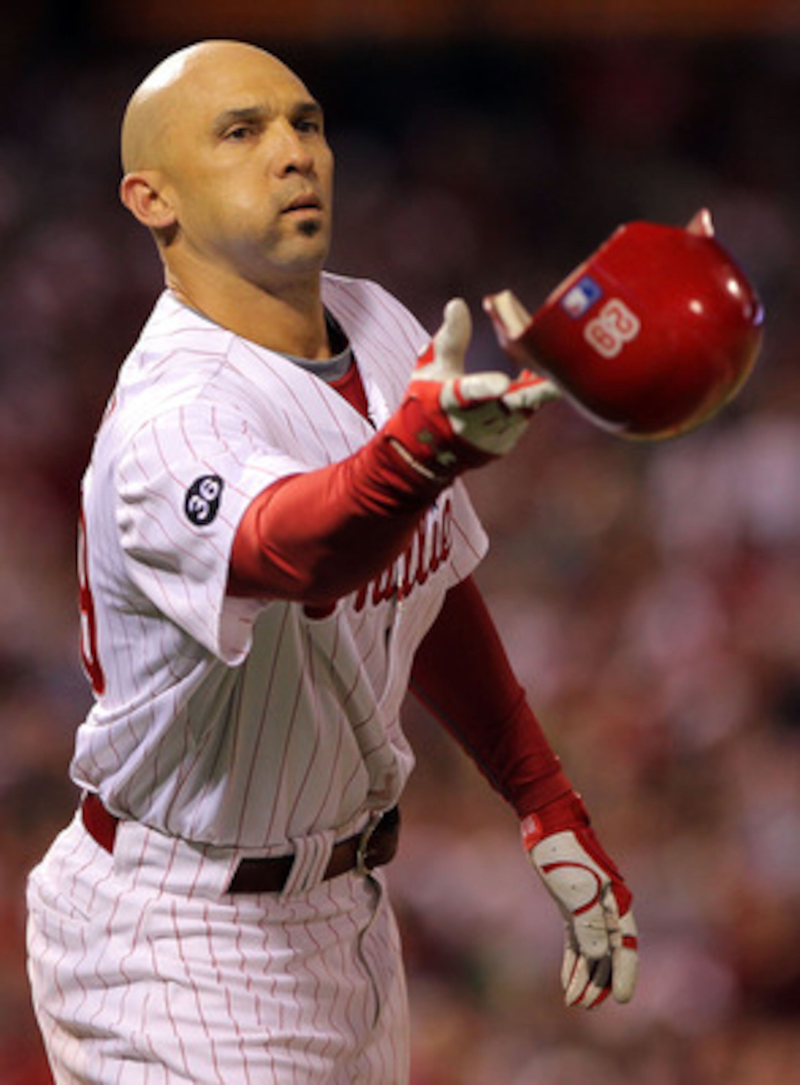PHILADELPHIA - OCTOBER 17:  Raul Ibanez #29 of the Philadelphia Phillies throws his helmet from first base in the seventh inning against the San Francisco Giants in Game Two of the NLCS during the 2010 MLB Playoffs at Citizens Bank Park on October 17, 201