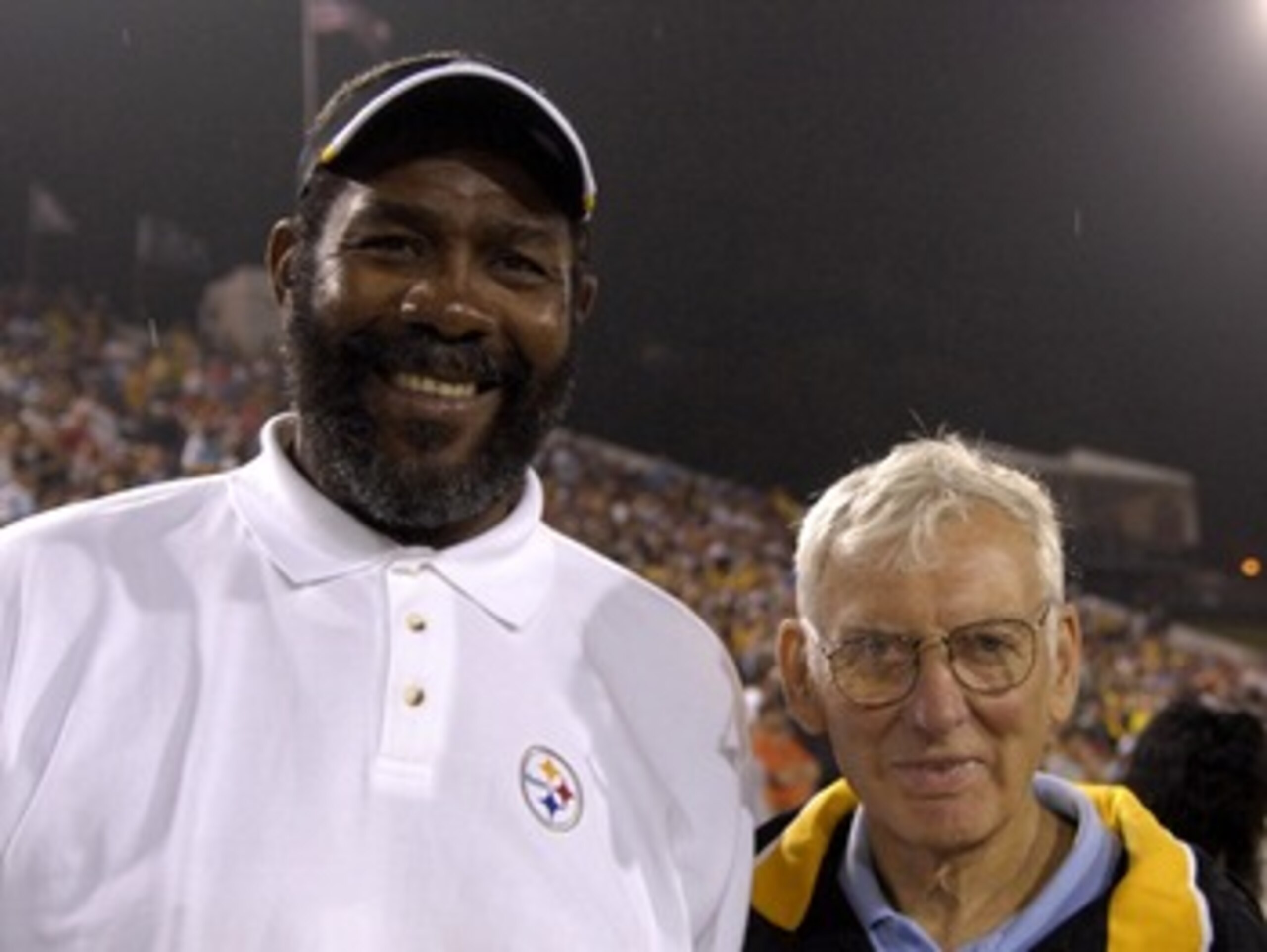 CANTON, OH - AUGUST 5:  Joe Greene and owner Dan Rooney of the Pittsburgh Steelers pose on the field during the AFC-NFC Pro Football Hall of Fame Game against the New Orleans Saints at Fawcett Stadium August 5, 2007 in Canton, Ohio.  (Photo by Al Messersc
