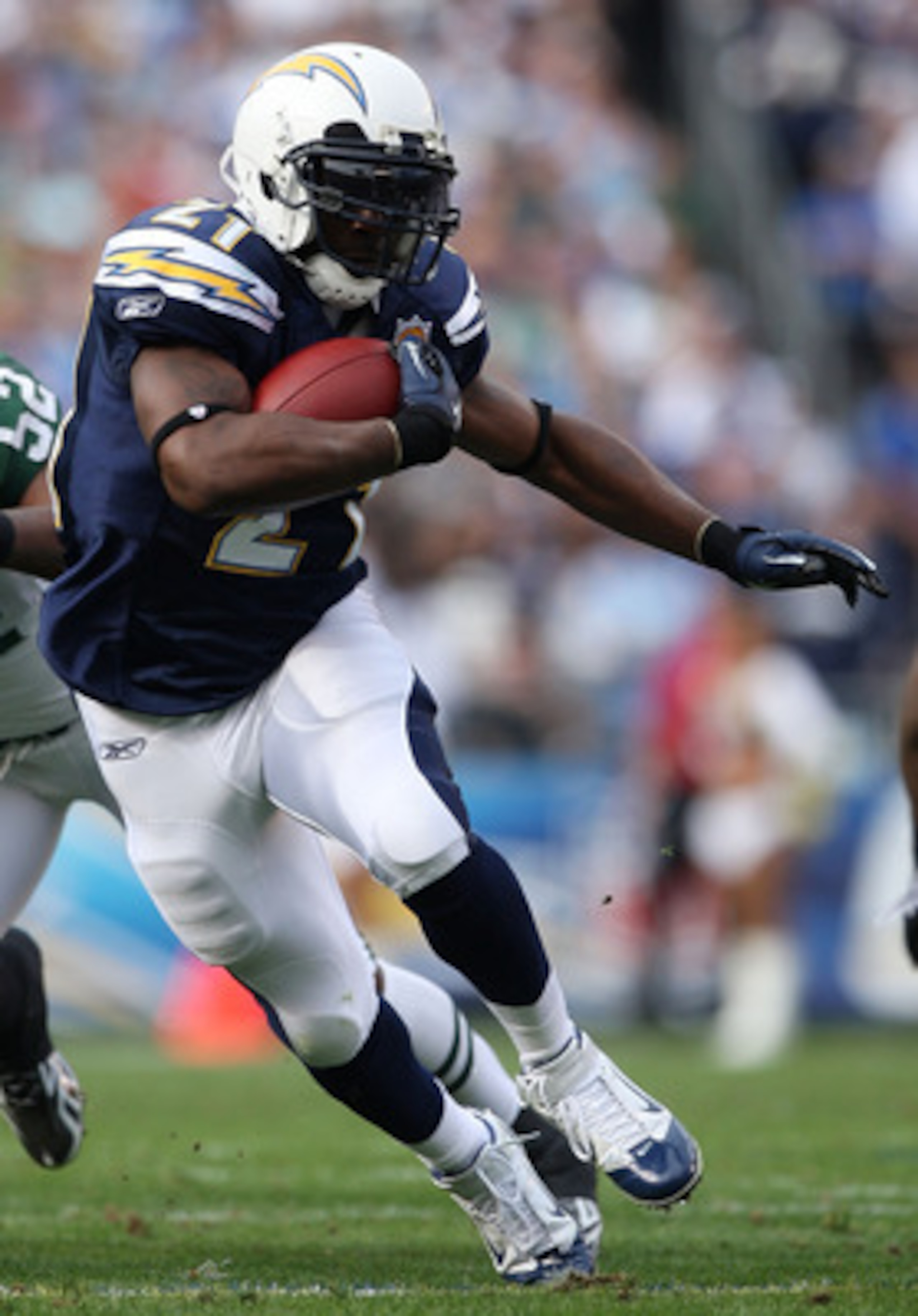 SAN DIEGO - JANUARY 17:  Running back LaDainian Tomlinson #21 of the San Diego Chargers runs with the ball against the New York Jets during the AFC Divisional Playoff Game at Qualcomm Stadium on January 17, 2010 in San Diego, California.  (Photo by Donald