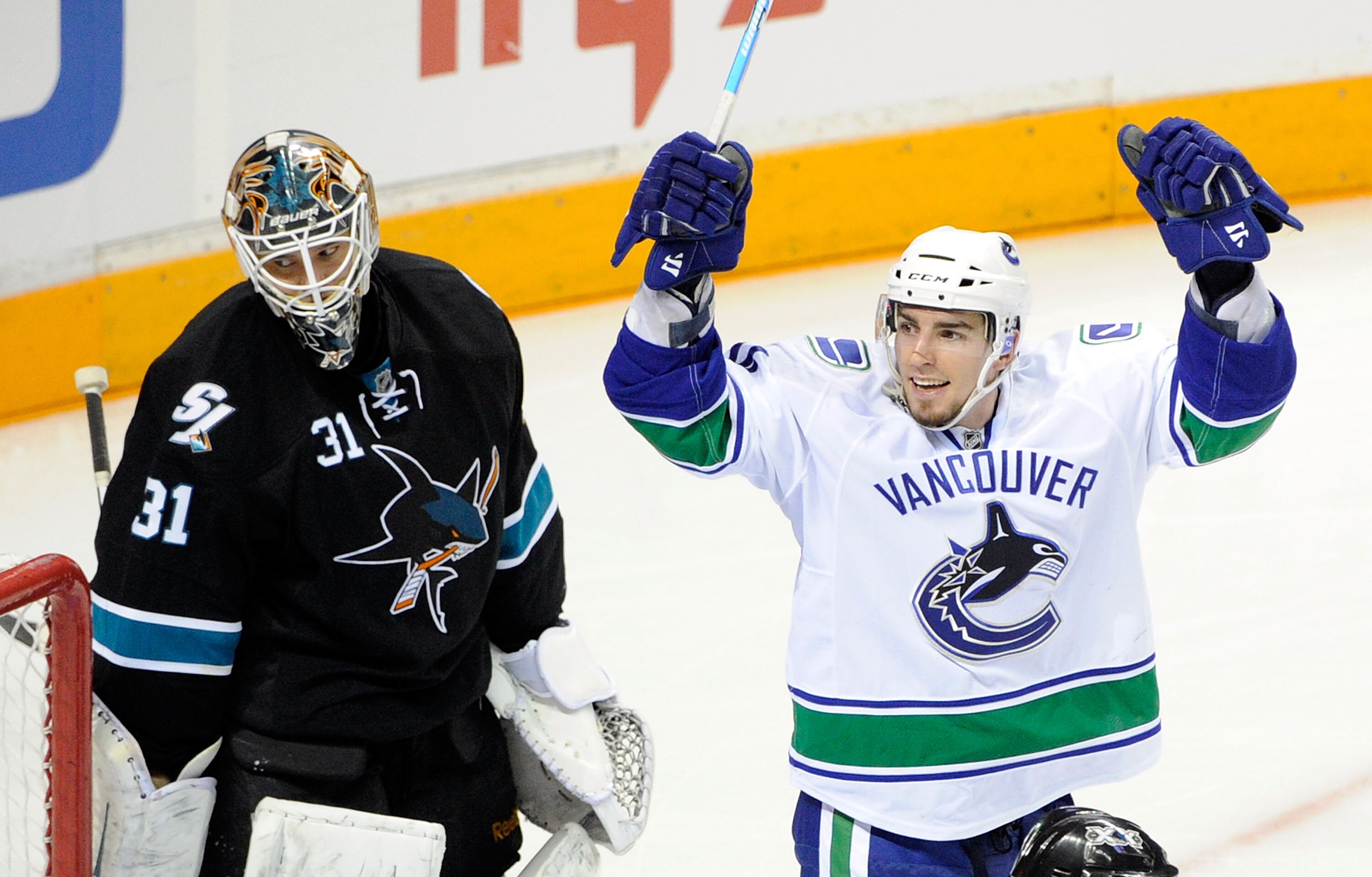 SAN JOSE, CA - MAY 22:  Alex Burrows #14 of the Vancouver Canucks celebrates after scoring in the third period as goaltender Antti Niemi #31 of the San Jose Sharks looks on in Game Four of the Western Conference Finals during the 2011 Stanley Cup Playoffs