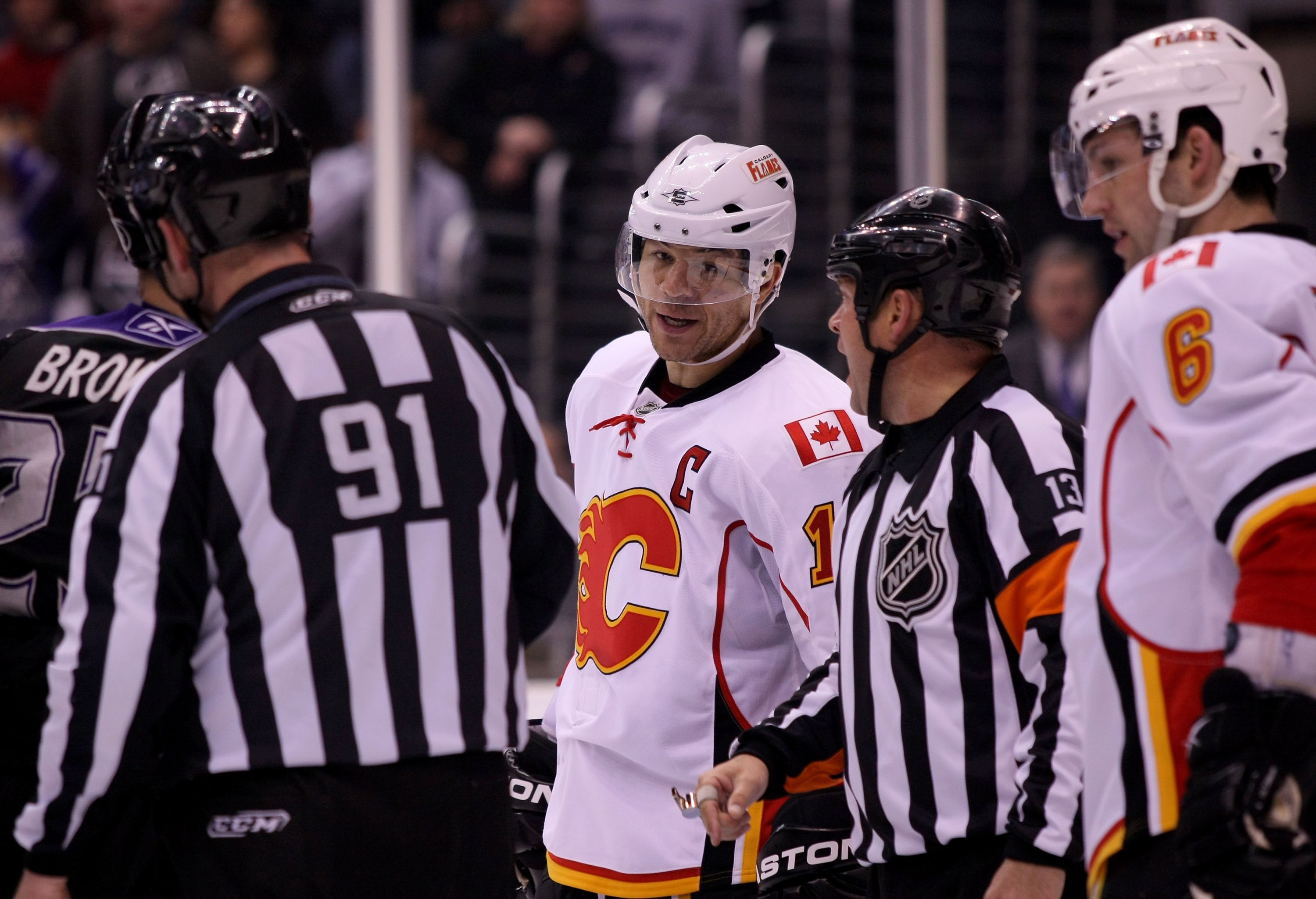 LOS ANGELES, CA - MARCH 21:  Jarome Iginla #12 of the Calgary Flames listens to referee Dan O'Halloran during their NHL game against the Los Angeles Kings at Staples Center on March 21, 2011 in Los Angeles, California. The Kings defeated the Flames 2-1 in