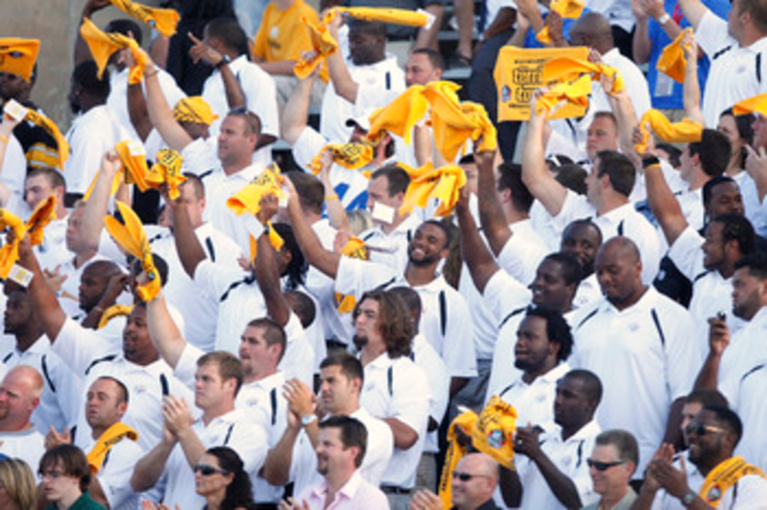 CANTON, OH - AUGUST 7: Members of the Pittsburgh Steelers wave the Terrible Towels as Dick LeBeau is introduced during the 2010 Pro Football Hall of Fame Enshrinement Ceremony at the Pro Football Hall of Fame Field at Fawcett Stadium on August 7, 2010 in CANTON, OH - AUGUST 7: Members of the Pittsburgh Steelers wave the Terrible Towels as Dick LeBeau is introduced during the 2010 Pro Football Hall of Fame Enshrinement Ceremony at the Pro Football Hall of Fame Field at Fawcett Stadium on August 7, 2010 in