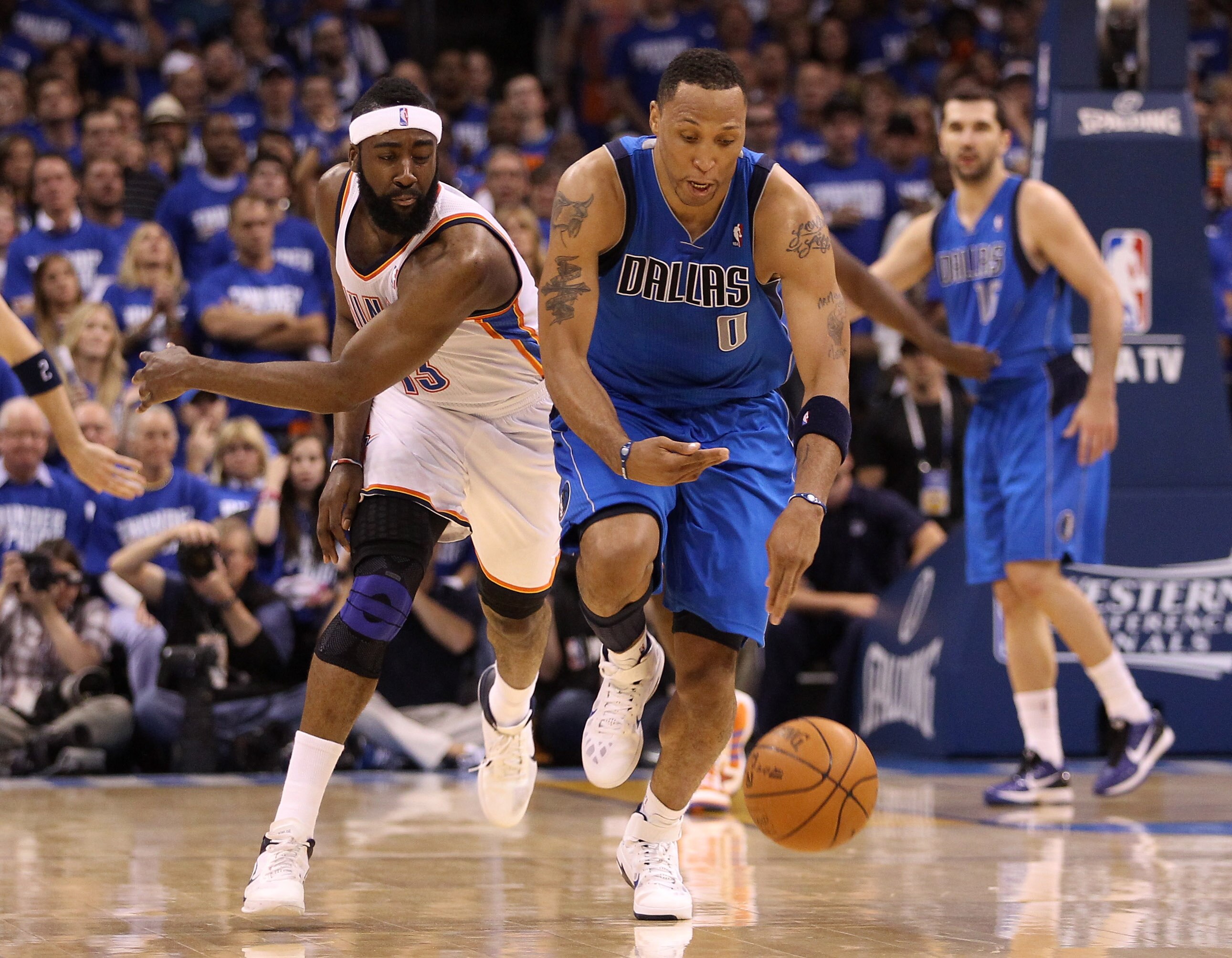 OKLAHOMA CITY, OK - MAY 21:  Shawn Marion #0 of the Dallas Mavericks and James Harden #13 of the Oklahoma City Thunder go after the ball in Game Three of the Western Conference Finals during the 2011 NBA Playoffs at Oklahoma City Arena on May 21, 2011 in