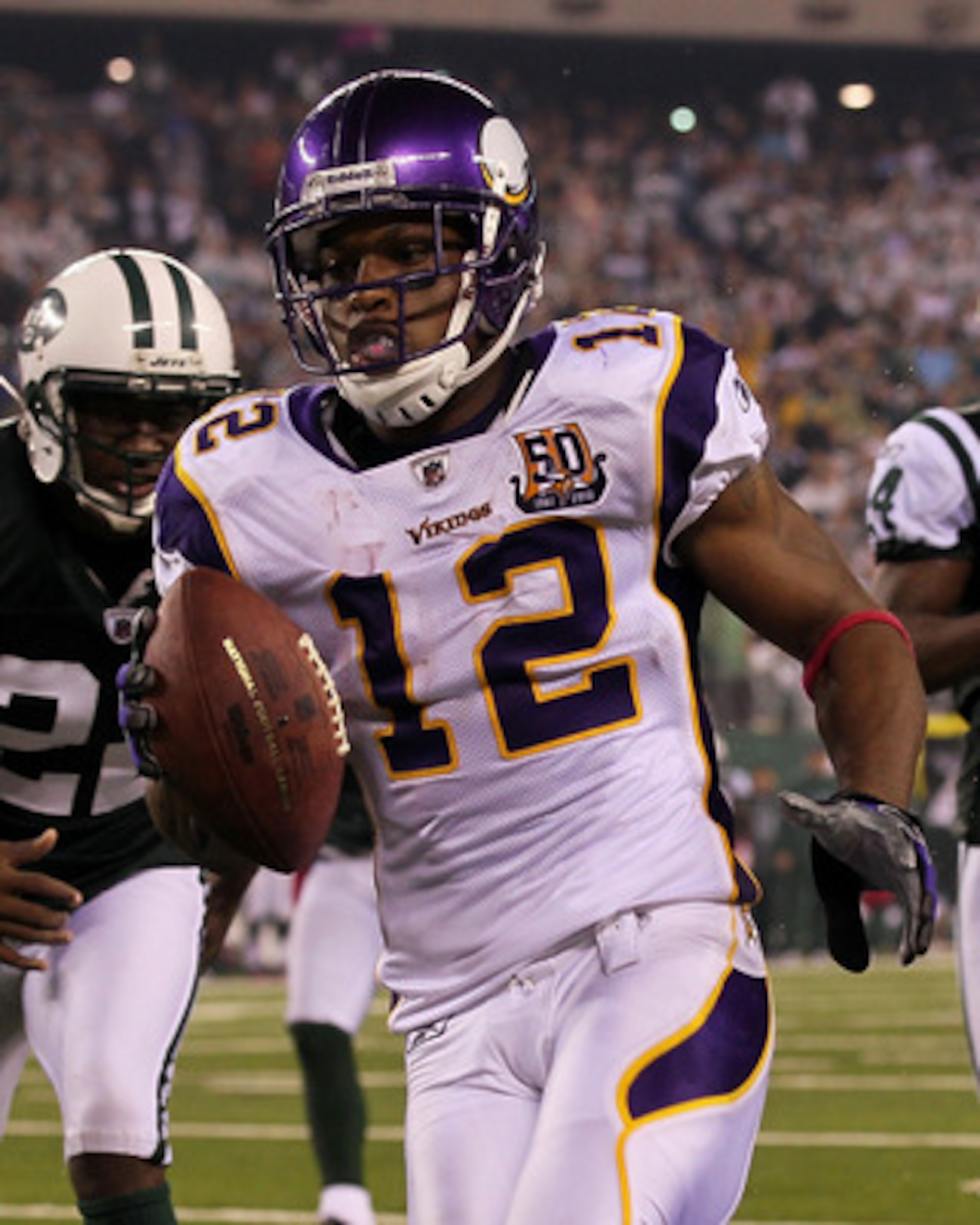 EAST RUTHERFORD, NJ - OCTOBER 11:  Percy Harvin #12 of the Minnesota Vikings scores a 34-yard touchdown reception in the fourth quarter against the New York Jets at New Meadowlands Stadium on October 11, 2010 in East Rutherford, New Jersey.  (Photo by Jim