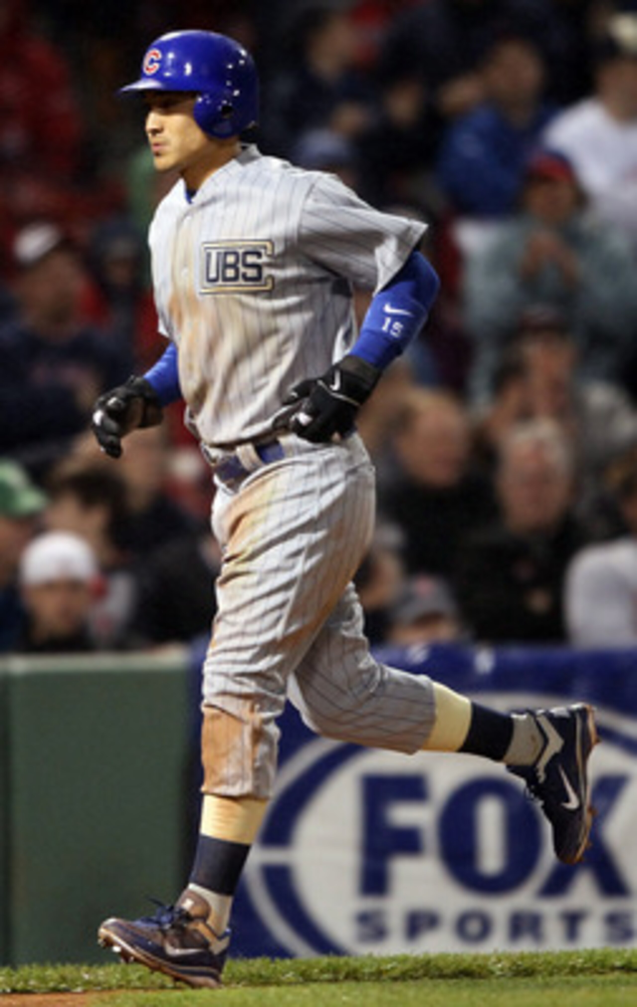 BOSTON, MA - MAY 21:  Darwin Barney #15 of the Chicago Cubs scores after Carlos Pena is walked with the bases loaded in the eighth inning against the Boston Red Sox on May 21, 2011 at Fenway Park in Boston, Massachusetts. Tonight the Chicago Cubs and the 