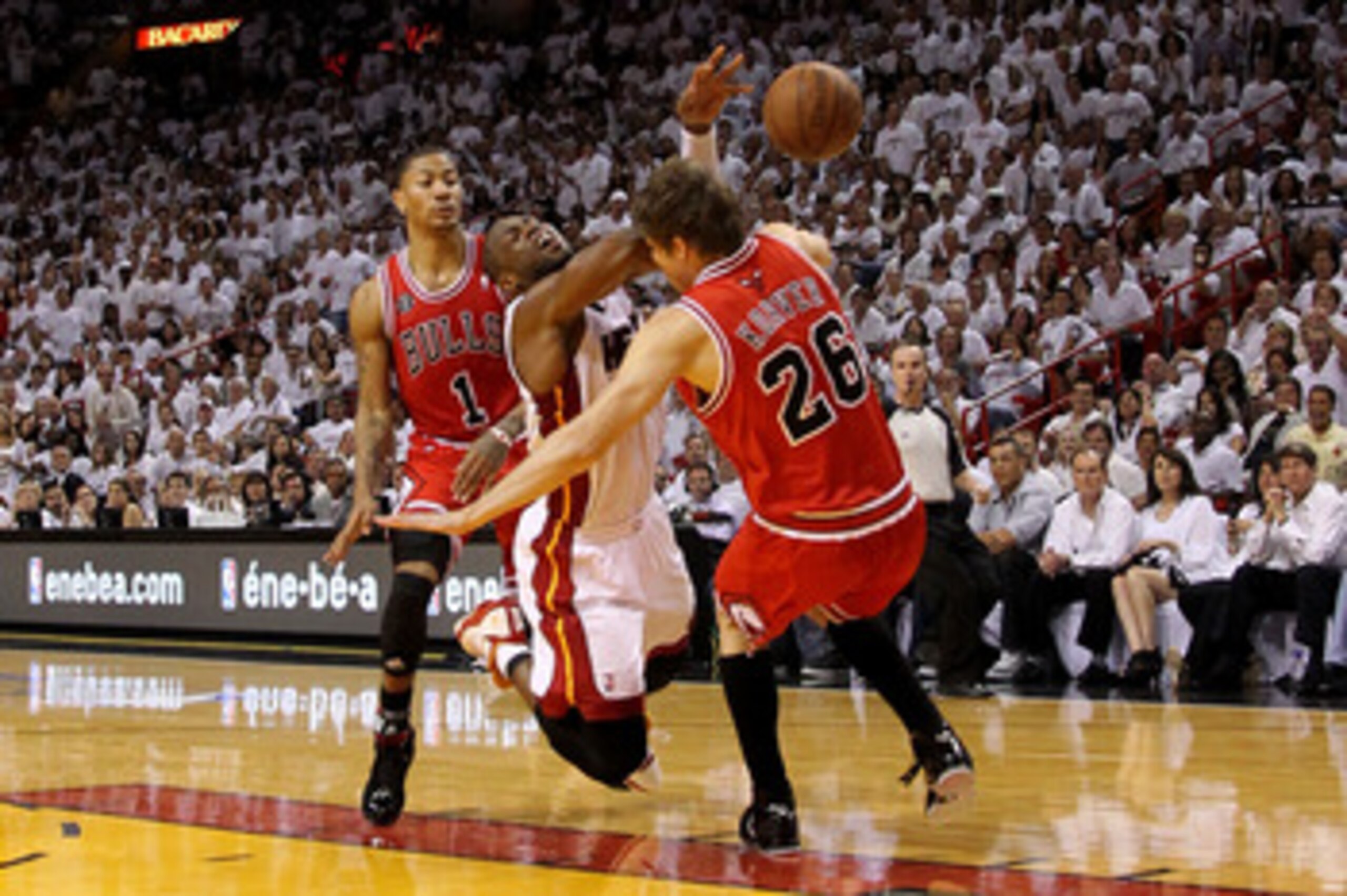 MIAMI, FL - MAY 22: Dwyane Wade #3 of the Miami Heat loses the ball as he drives against Kyle Korver #26 and Derrick Rose #1 of the Chicago Bulls in Game Three of the Eastern Conference Finals during the 2011 NBA Playoffs on May 22, 2011 at American Airl MIAMI, FL - MAY 22: Dwyane Wade #3 of the Miami Heat loses the ball as he drives against Kyle Korver #26 and Derrick Rose #1 of the Chicago Bulls in Game Three of the Eastern Conference Finals during the 2011 NBA Playoffs on May 22, 2011 at American Airl