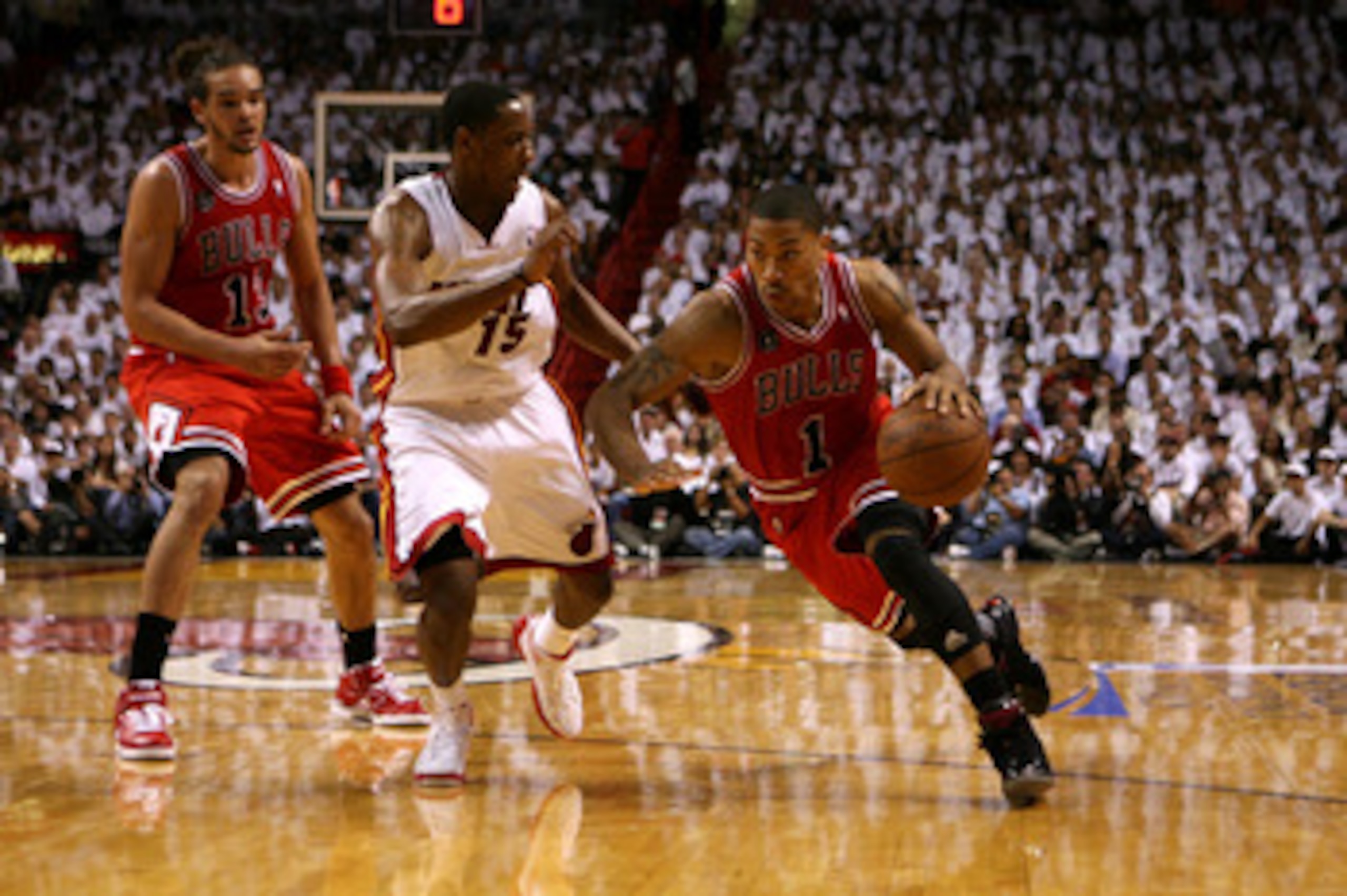MIAMI, FL - MAY 22: Derrick Rose #1 of the Chicago Bulls drives against Mario Chalmers #15 of the Miami Heat in Game Three of the Eastern Conference Finals during the 2011 NBA Playoffs on May 22, 2011 at American Airlines Arena in Miami, Florida. NOTE T MIAMI, FL - MAY 22: Derrick Rose #1 of the Chicago Bulls drives against Mario Chalmers #15 of the Miami Heat in Game Three of the Eastern Conference Finals during the 2011 NBA Playoffs on May 22, 2011 at American Airlines Arena in Miami, Florida. NOTE T